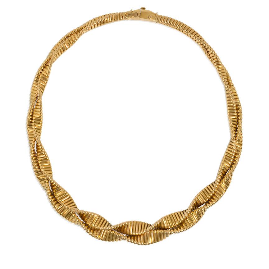 A Retro gold gas pipe collar necklace comprised of two twisted and slightly graduated rows, in 18k.  Maker's mark for Troussard, France. 