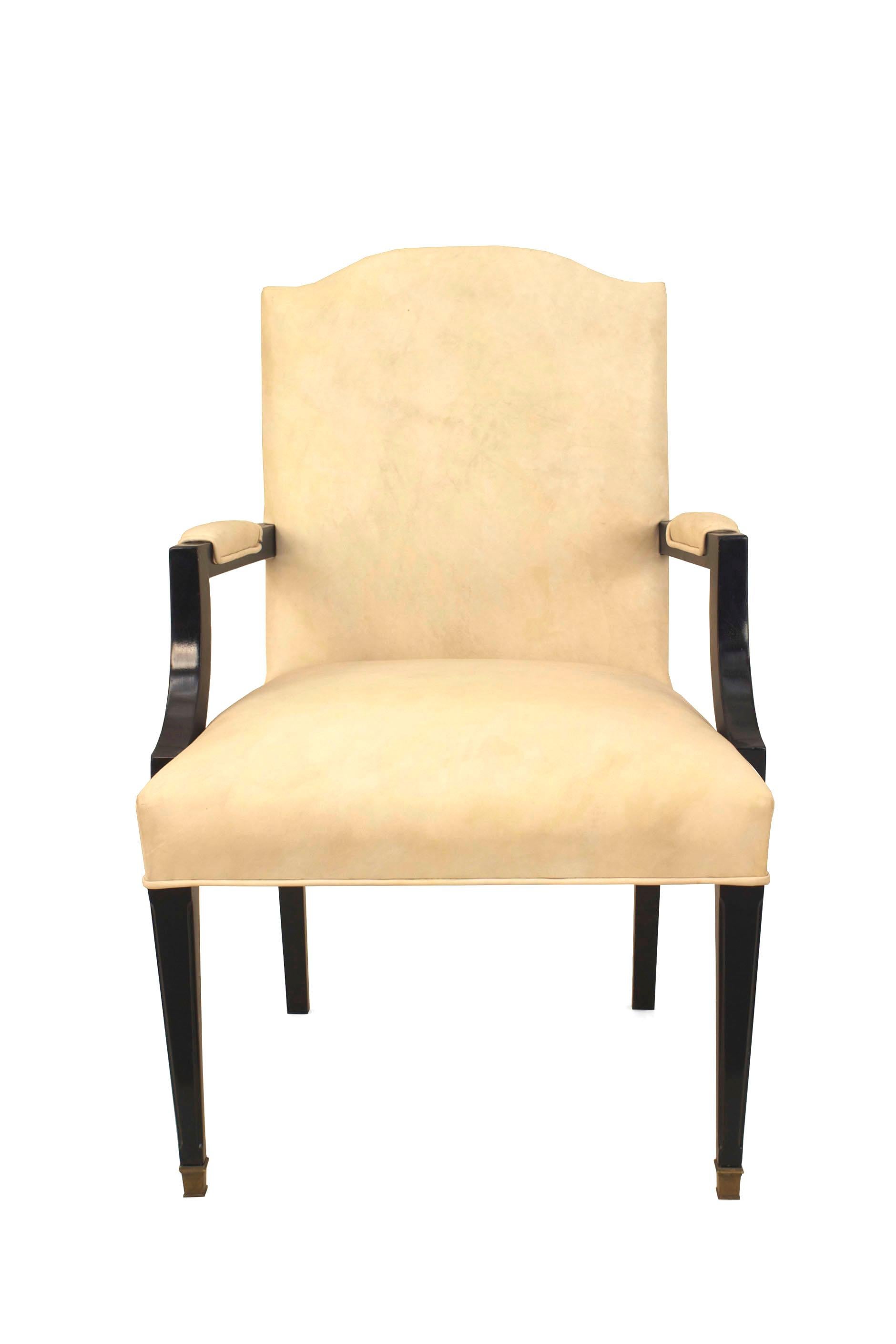 French 1940s ‘Louis XVI style’ ebonized arm chair with a shaped back and white leather upholstered seat, back and arm rests. Attributed JANSEN.

Maison Jansen was a Paris-based interior decoration office founded in 1880 by Dutch-born Jean-Henri