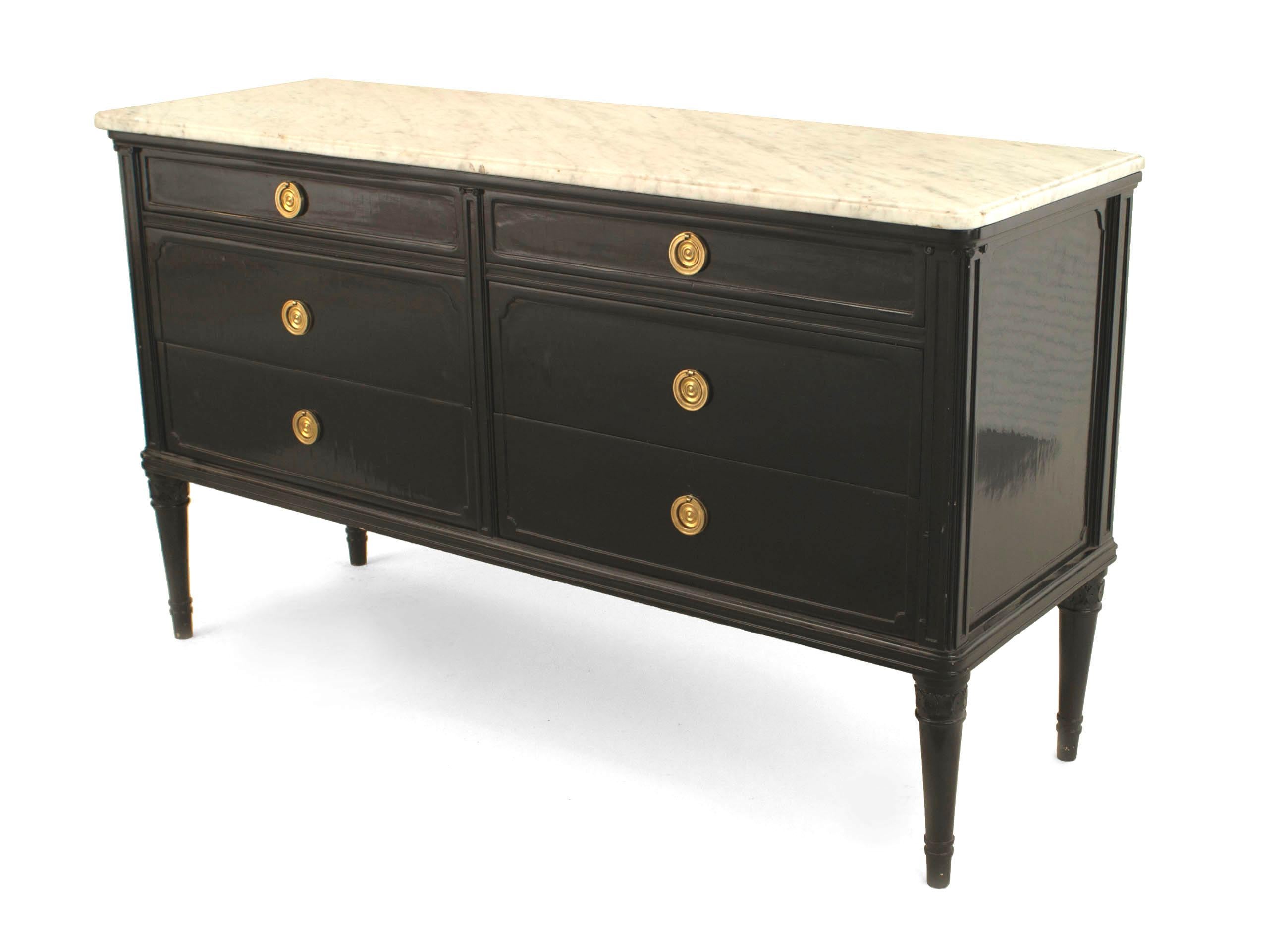 French Louis XVI style (1940s ) ebonized chest with 4 larger drawers over 2 smaller with bronze ring handles and a white marble top. (stamped: JANSEN)
