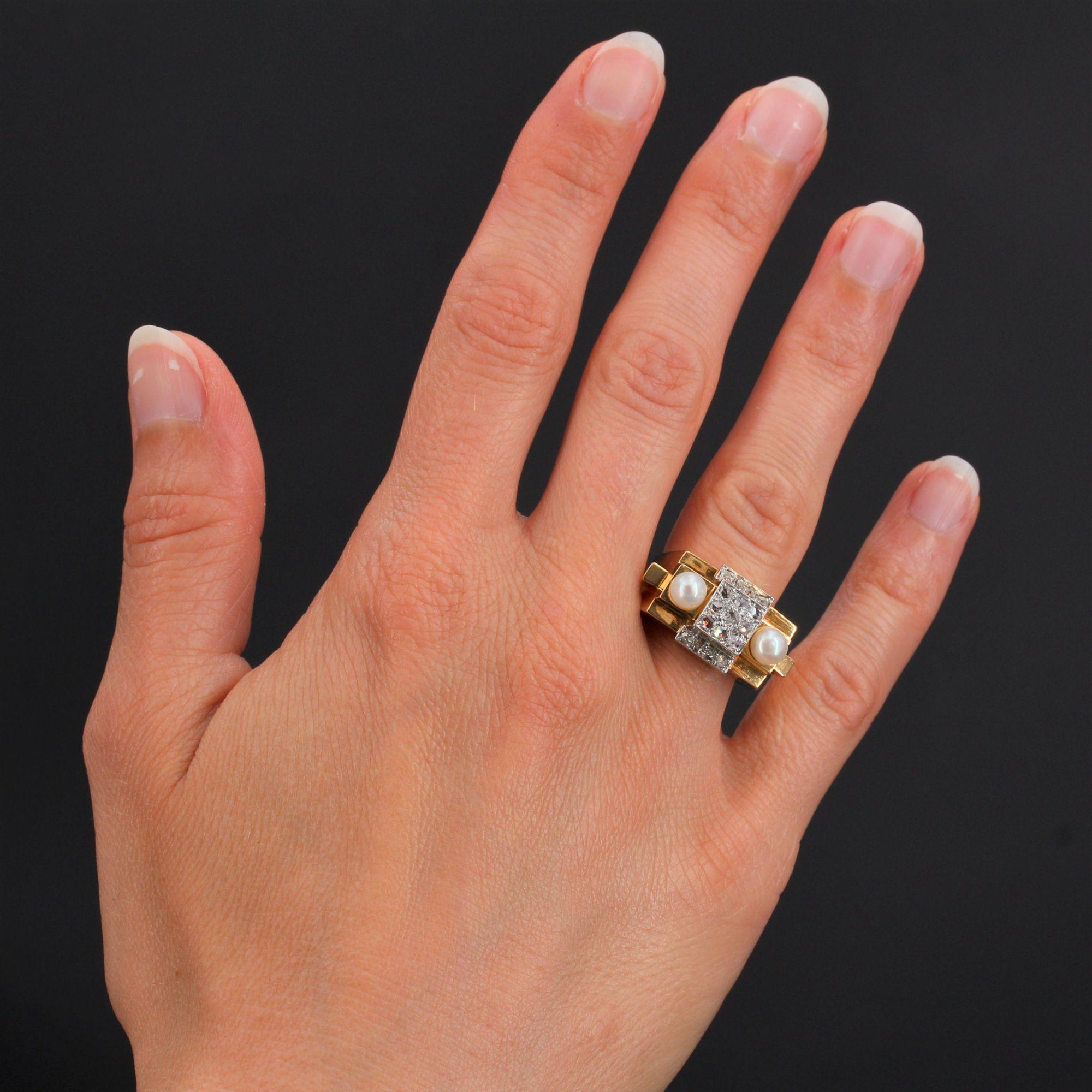 Ring in 18 karat yellow gold, eagle's head hallmark and platinum, dog's head hallmark.
Geometric, this tank ring has on its top three stepped patterns set with rose-cut diamonds, shouldered by natural pearls.
Total diamond weight : approximately