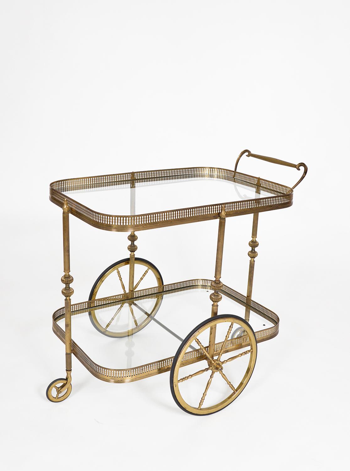 This gorgeous French 1940s neoclassical brass drinks trolley in the style of Maison Jansén is a great way of displaying your gin collection, and will give your dinner party a real touch of glamour! 
The trolley is beautifully made, it has two