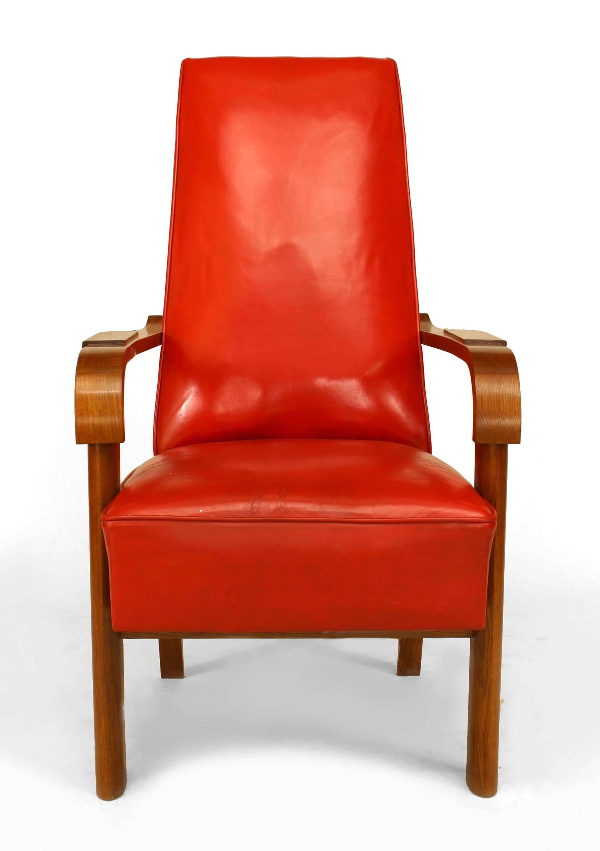 French 1940s oak arm chair with a high back and upholstered with a red leather seat and back. (C. DUDOUYT) (Matching desk: 060336)
