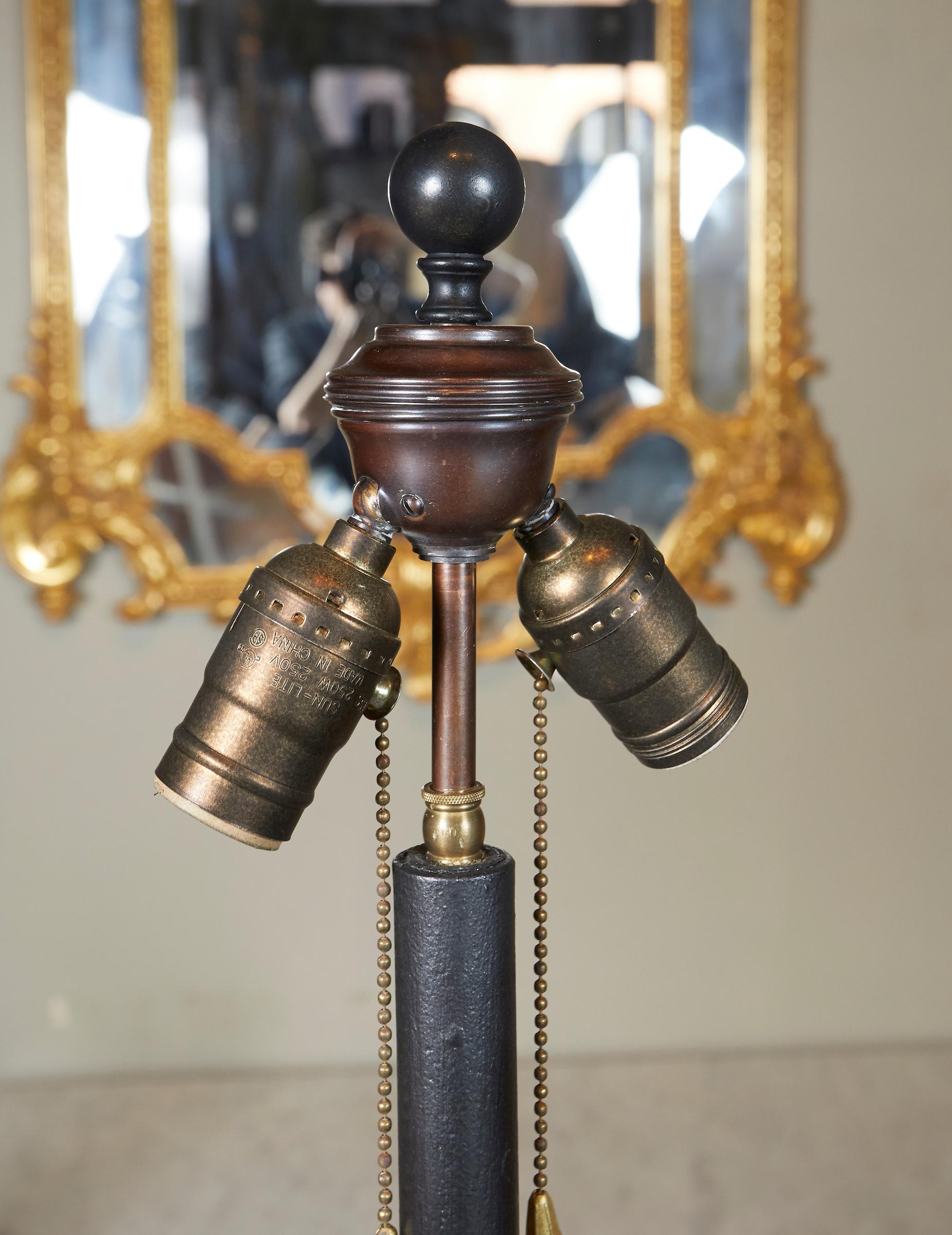 French 1940s patinated and gilt wrought iron floor lamp, in the manner of Gillebert Poillerat .

Diameter is the dimension of the base.
  