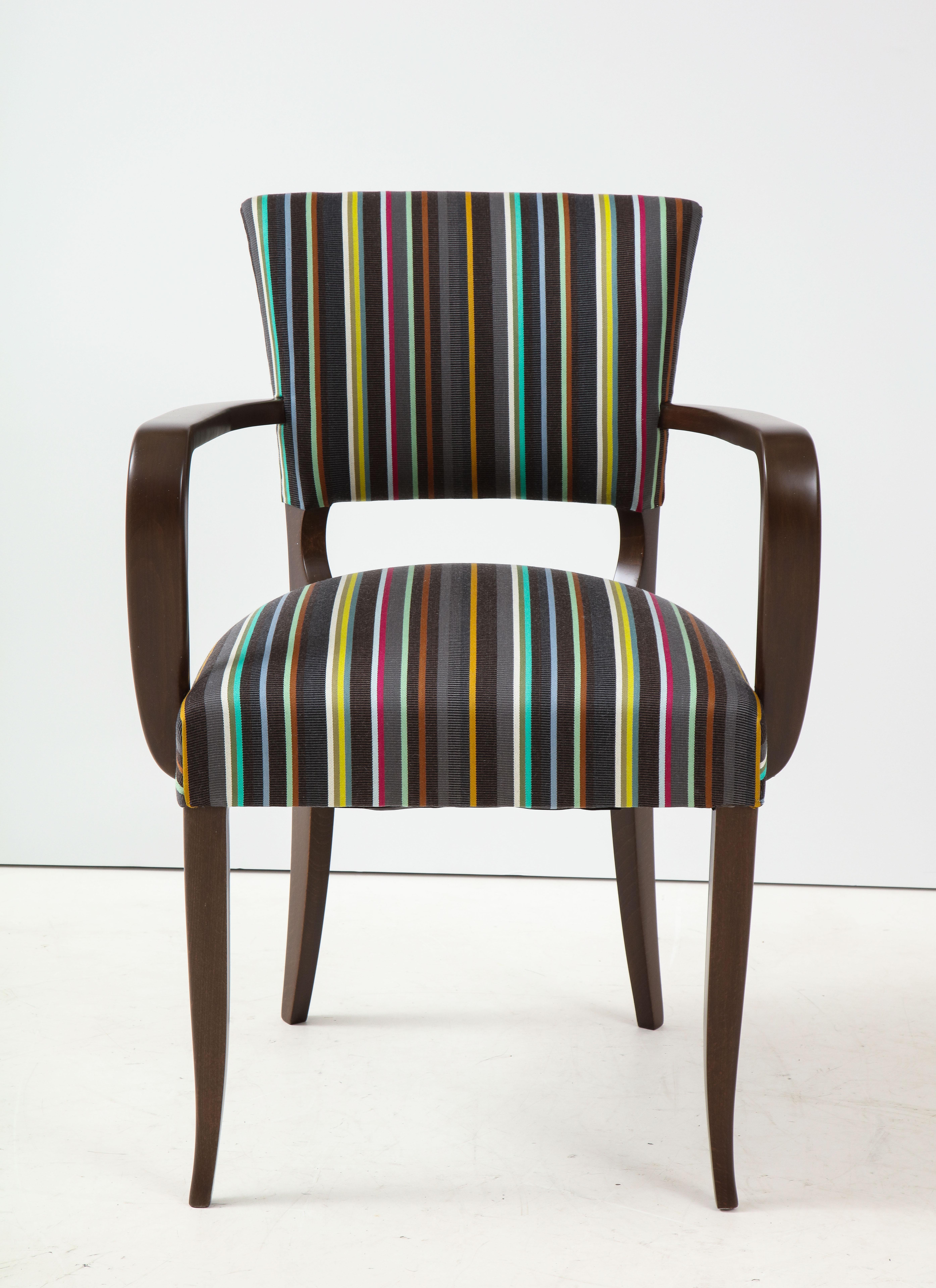 Pair of mint restored, Saville Row inspired French armchairs in a medium toned walnut color and custom upholstered in a Paul Smith striped fabric.