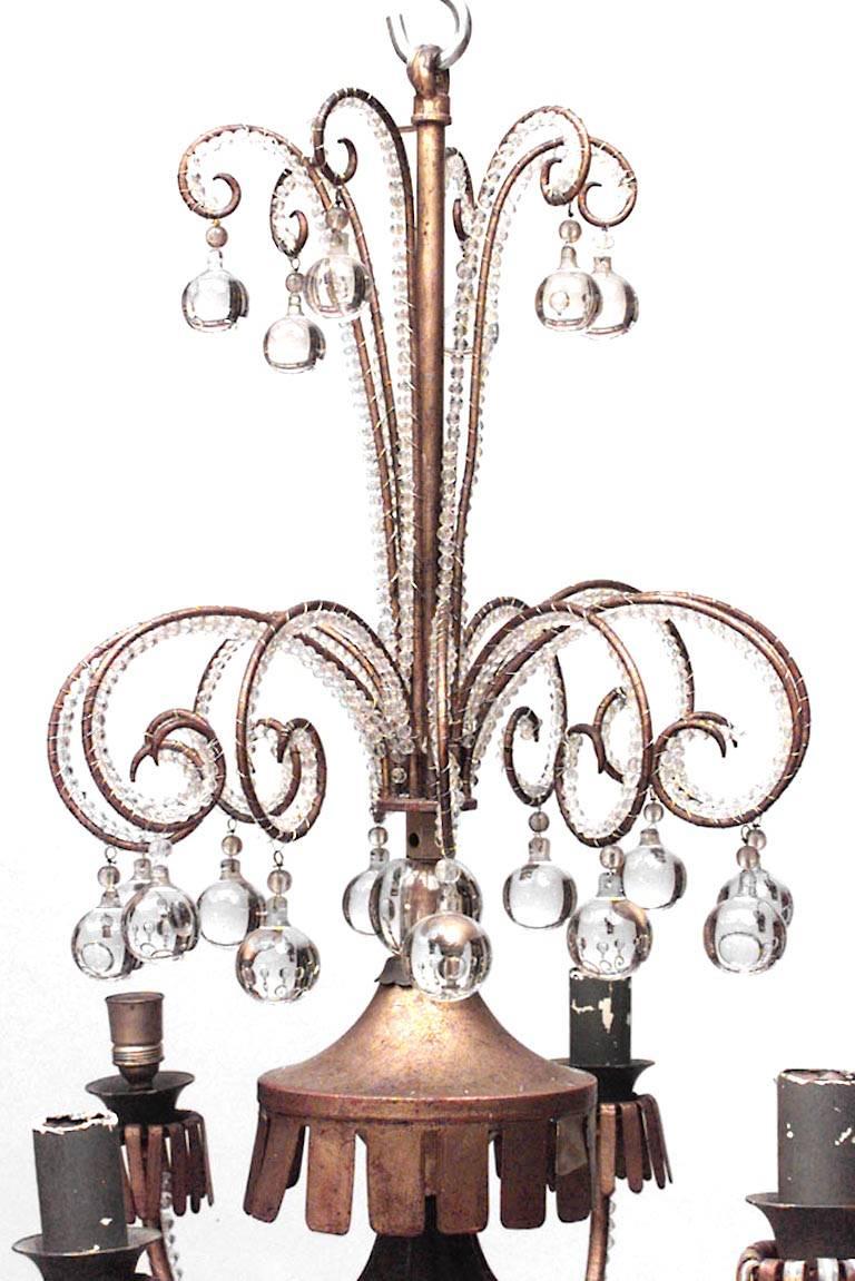 French Mid-Century (1940s) gilt metal scroll design 6 arm chandelier with beaded crystal trim and ball design. (Attributed to BAGUES)
