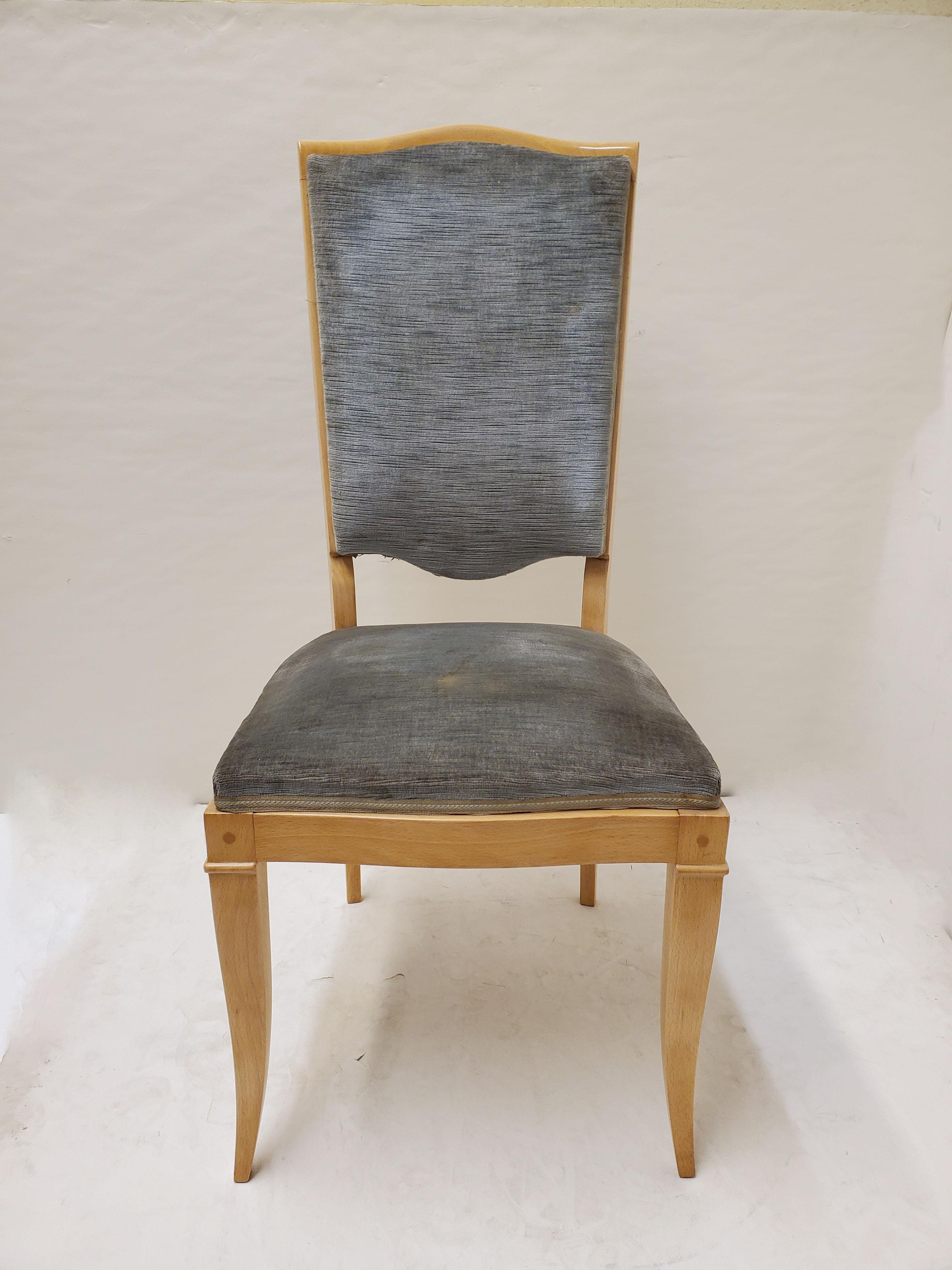 A beautiful set of eight original French 1940's tall back blonde wood dining chairs attributed to Jules Leleu.
Tall elegant backs with curvilinear top crest and shield shape lower backrest, featuring elegant cabriole front legs and slightly tapered