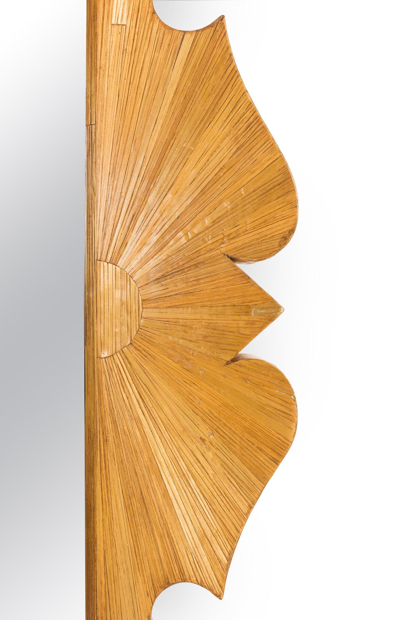 French 1940s straw veneered rectangular shaped frame wall mirror with scroll and sunburst design.
 