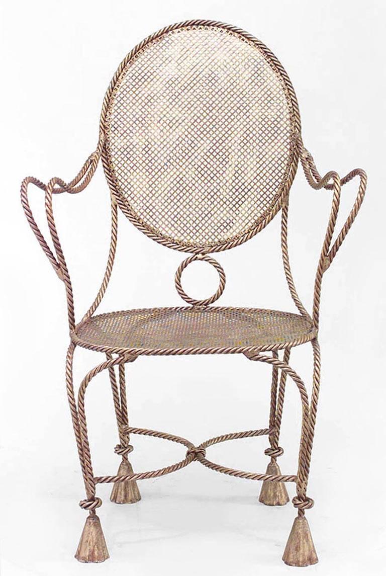 Three French 1940s style rope and tassel design gilt metal armchairs with oval mesh seat and back (priced each).
