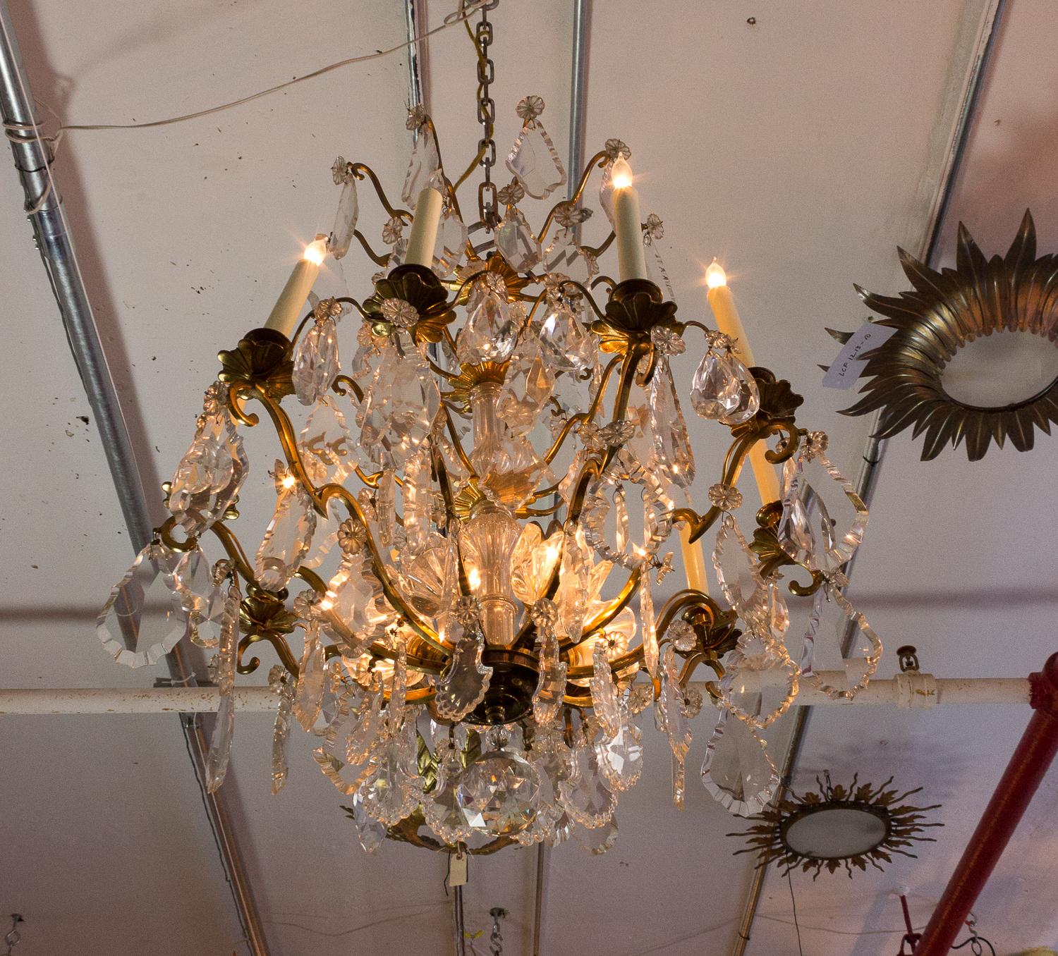 Stunning Baccarat chandelier with ten arms and five bottom lights. The frame is gilt bronze with Baccarat crystals. Circa 1940s