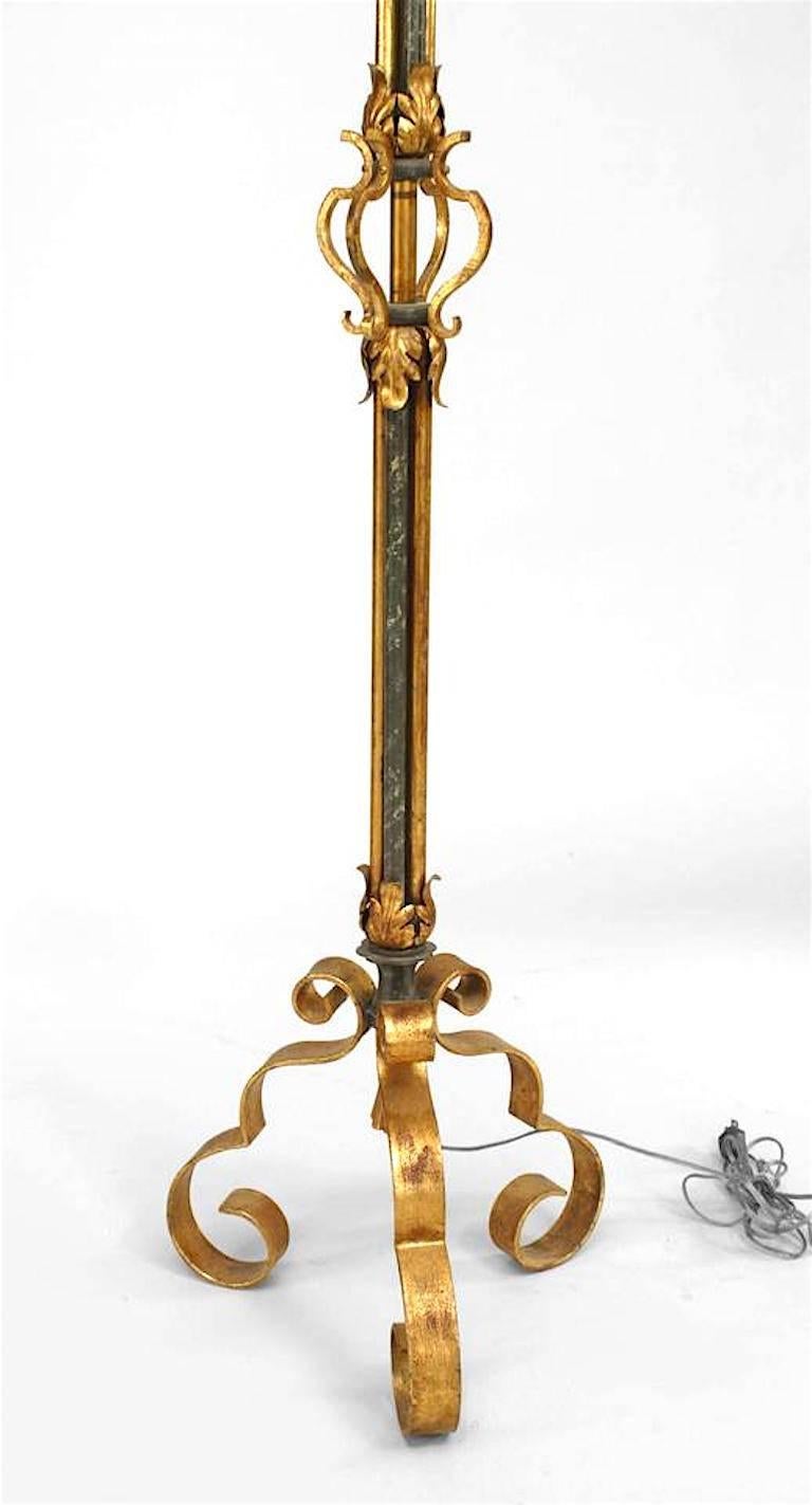 French 1940s wrought iron and gold trimmed floor lamp with triple scroll design base and floral trim (in the style of GILBERT POILLERAT).
