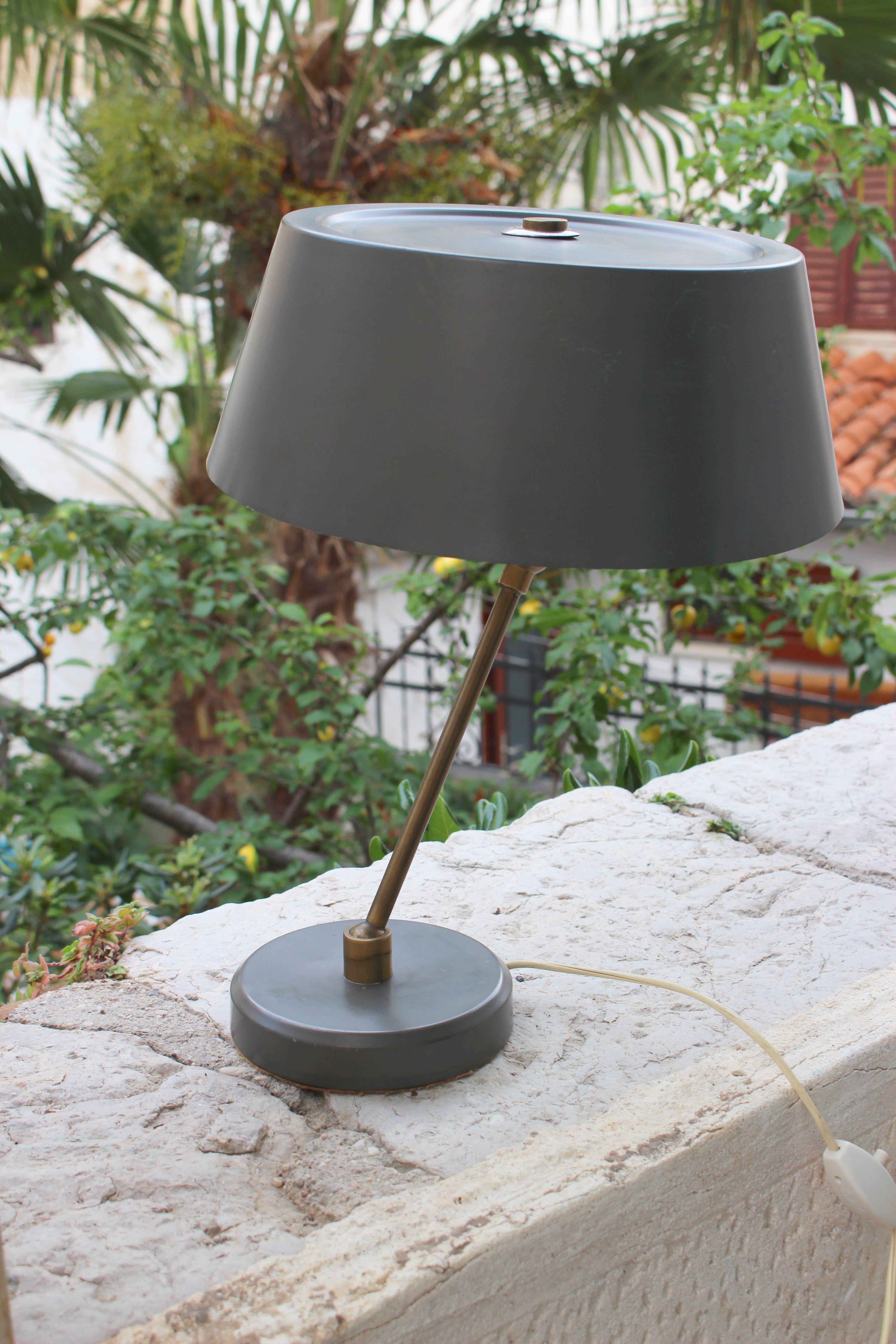 1950s desk lamp, grey military color adjustable shade and base as shown on the photos. Brass base and metal grey painted shade.
 