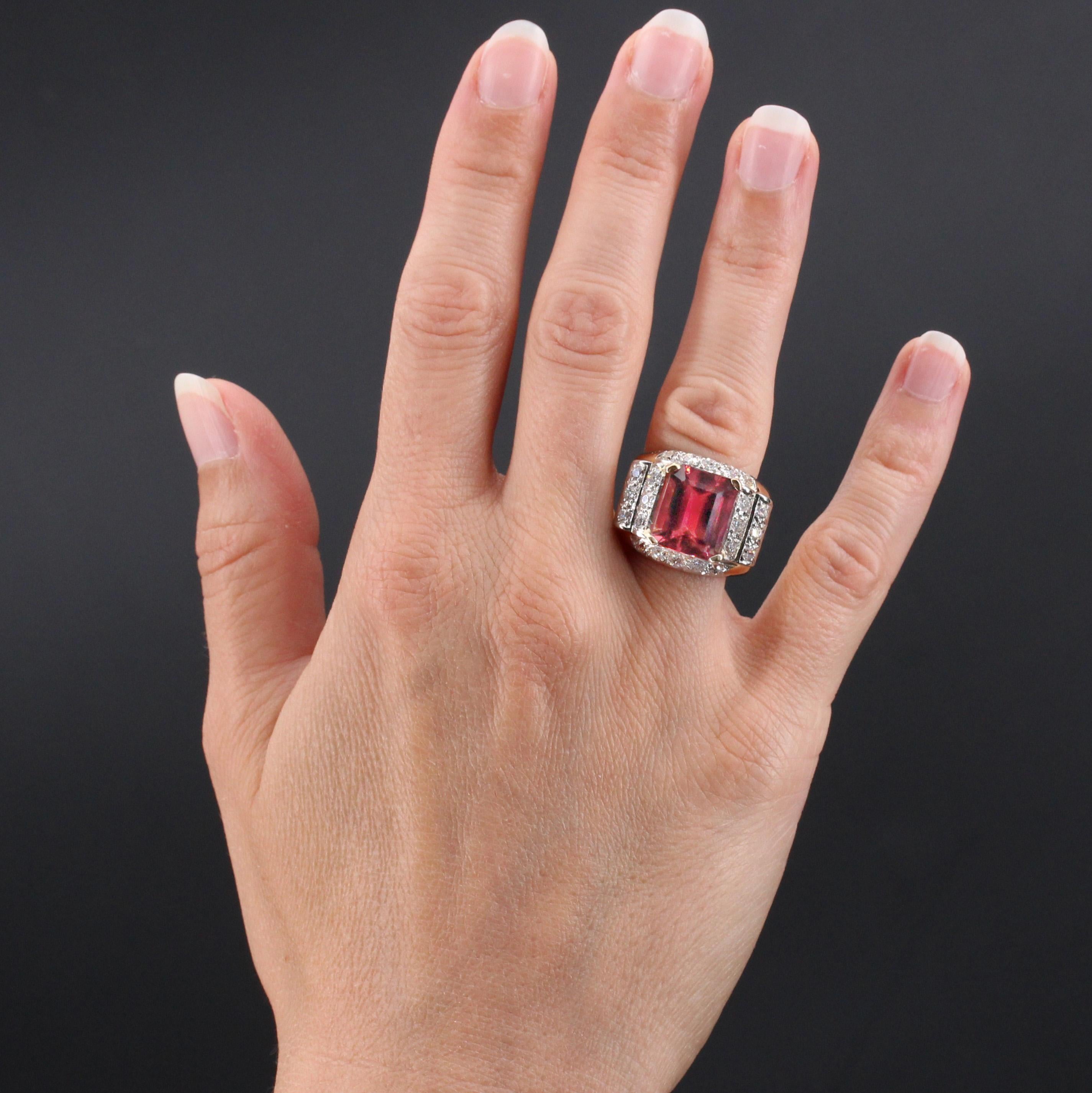 Ring in 18 karat rose gold and platinum, own and grotesque hallmarks.
Impressive tank ring, it presents a mounting in the shape of bridge and with steps, decorated with brilliant- cut diamonds. In the center, an important rubellite tourmaline held