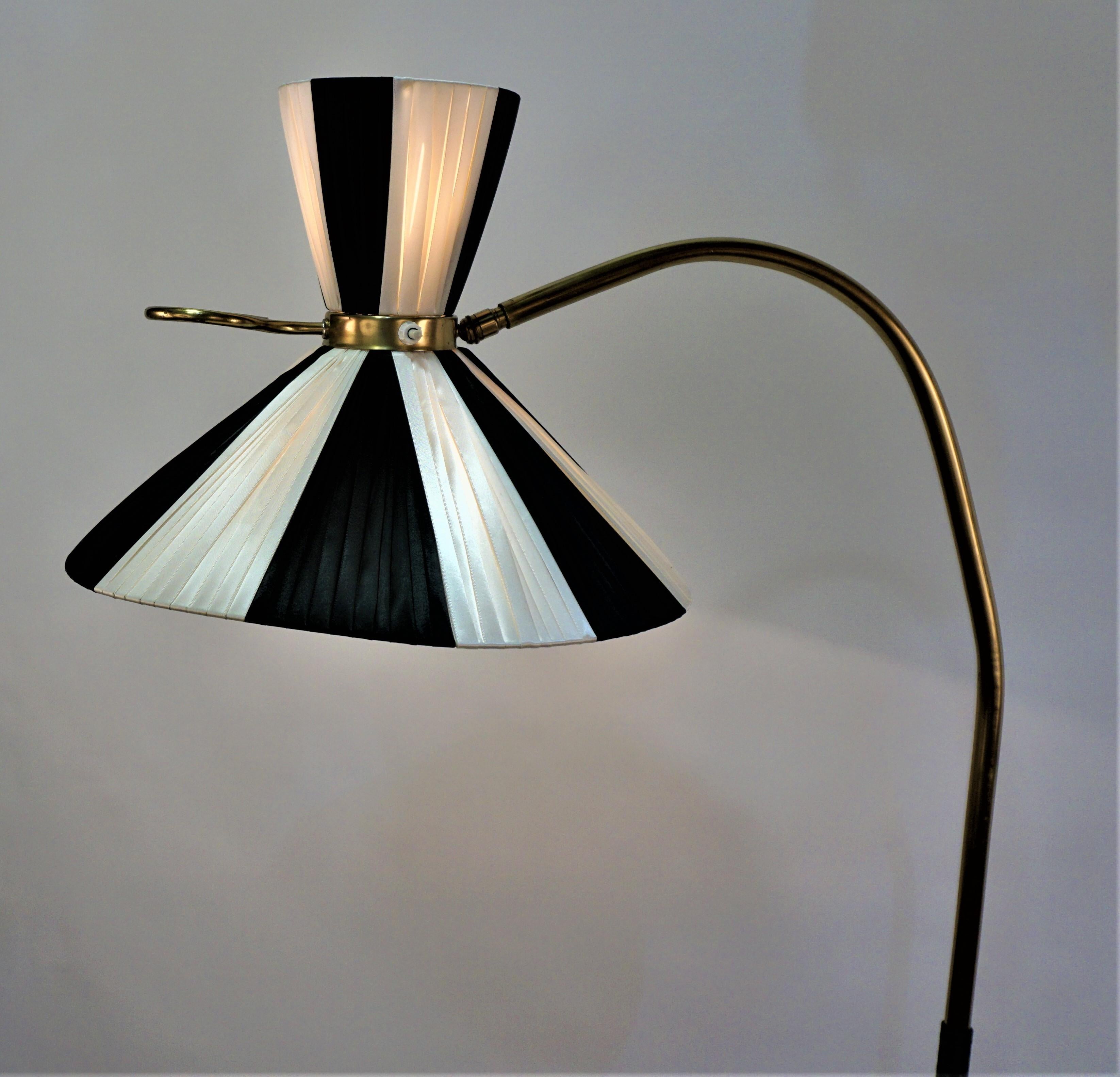 French 1950's bronze adjustable floor lamp from the base and where the shades attaches to the arm.
Original shade frame with new the same design wrapped fabric.
