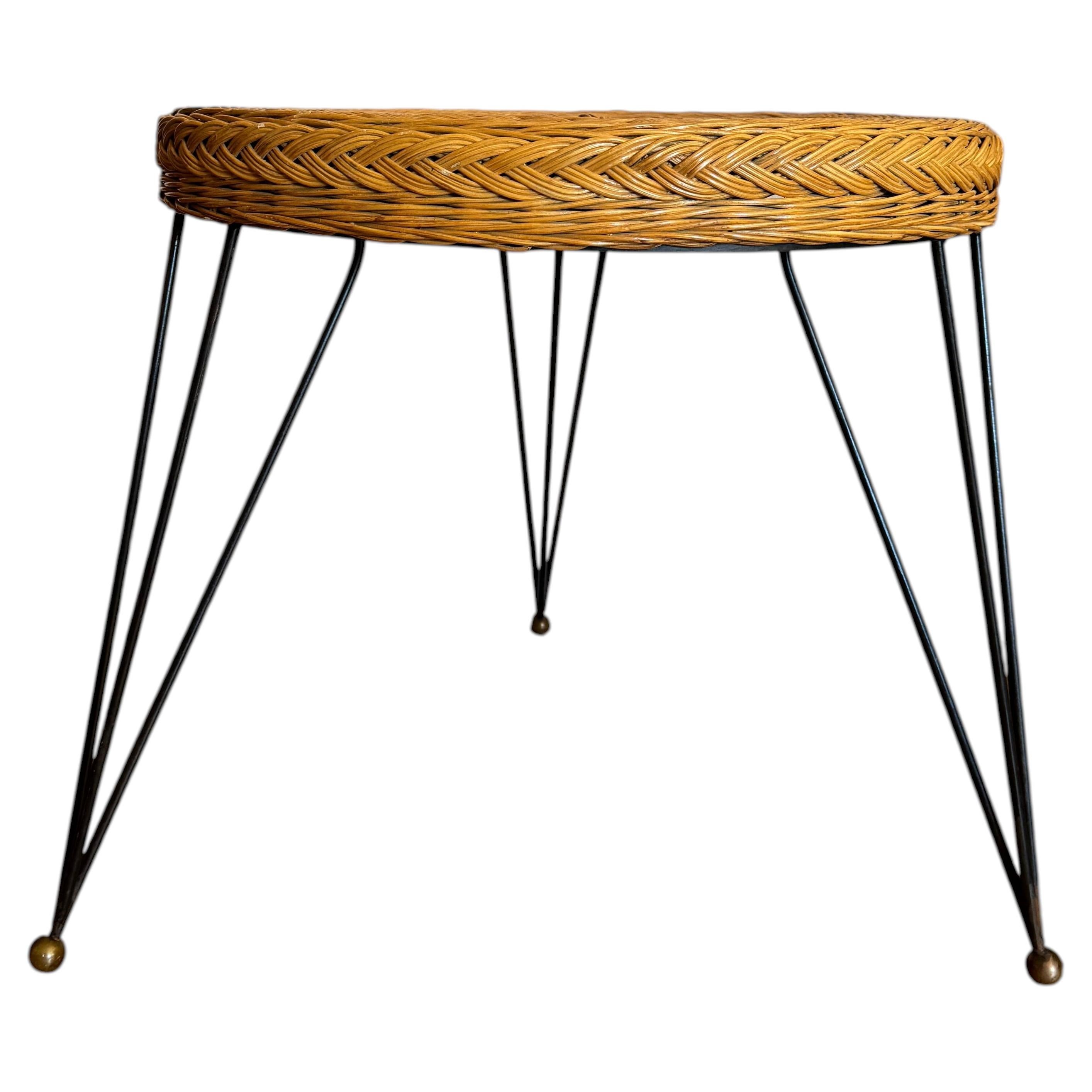 French 1950’s black metal and wicker side table style of Raoul Guys For Sale