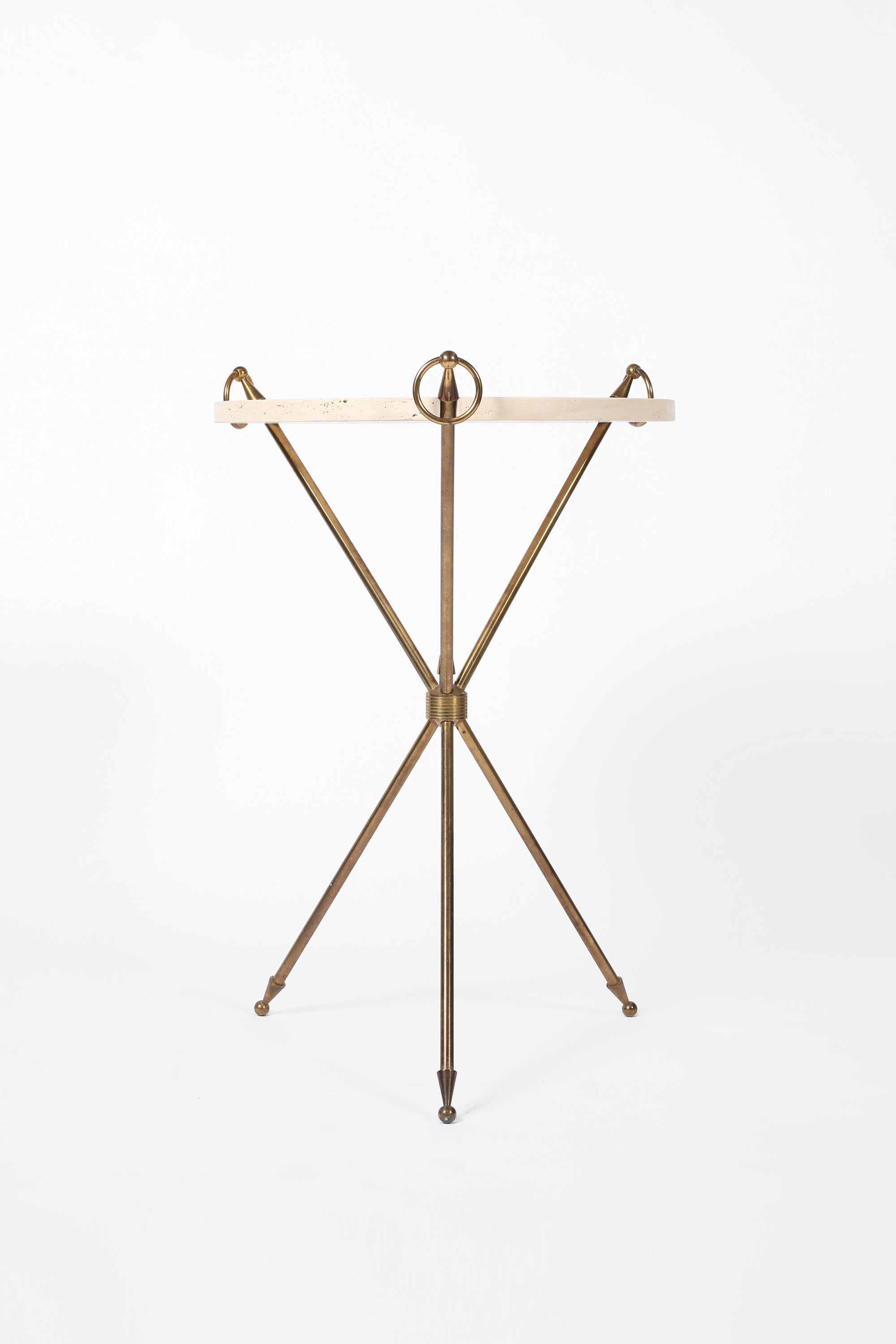 A chic brass & limestone gueridon with decorative ring detailing and tripod base, in the manner of Jean-Michel Frank. French, c. 1950s.