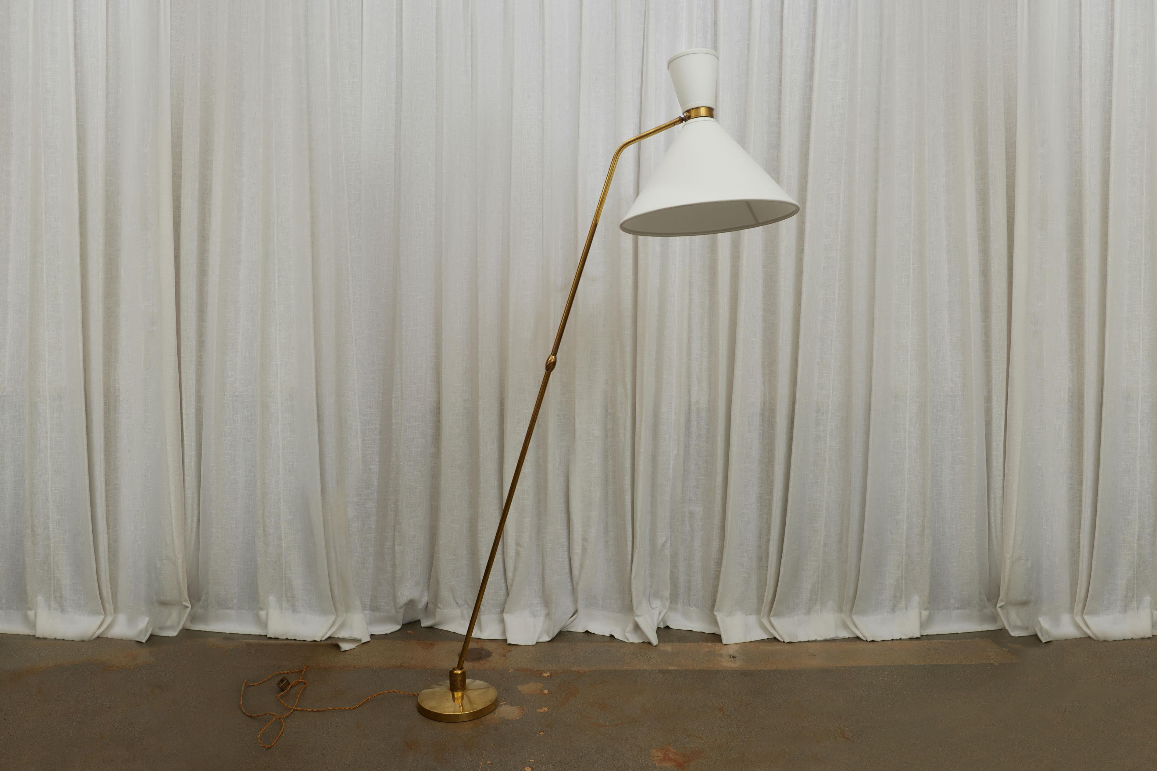 French 1950s Brass Floor Lamp by Maison Lunel 


This exquisite floor lamp, standing at 74