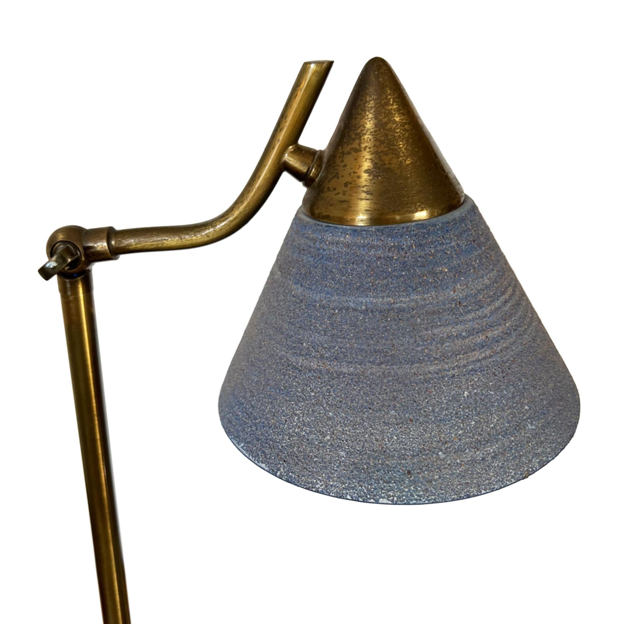 This charming little French mid century table lamp adds a perfect touch of colour with its original blue glass shade.

This light adjusts using the screw at the top of the column - take a look at the close up picture. 

Made from brass, which