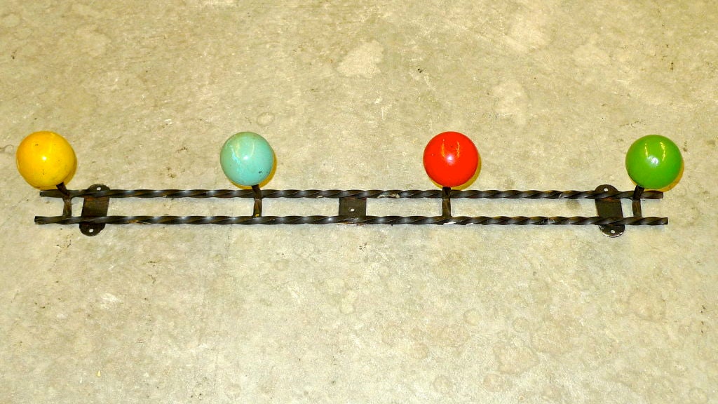 French 1950's twisted iron wall mounted coat hook with colorfully painted wooden balls