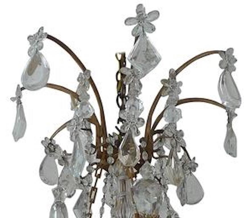 French 1950s crystal and glass Marie Therese chandelier with three-tiers and eight outer and four inner lights.
   