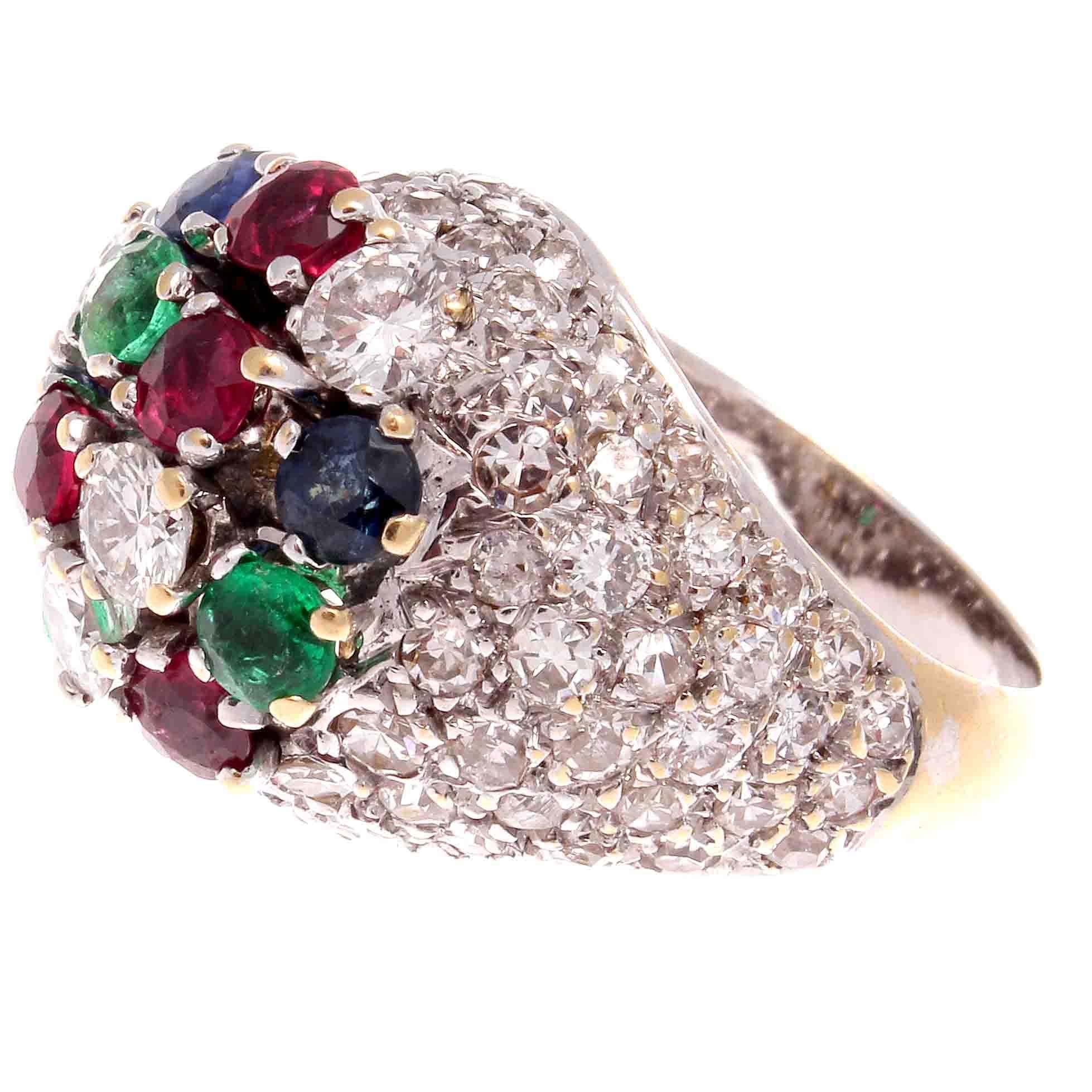 This colorful ring  is in the best tradition of tutti fruti, playful, light hearted and charming. Featuring numerous new colorless diamonds mixed with vivid blue sapphires, red rubies and green emeralds. Hand crafted in 18k gold. Stamped with French