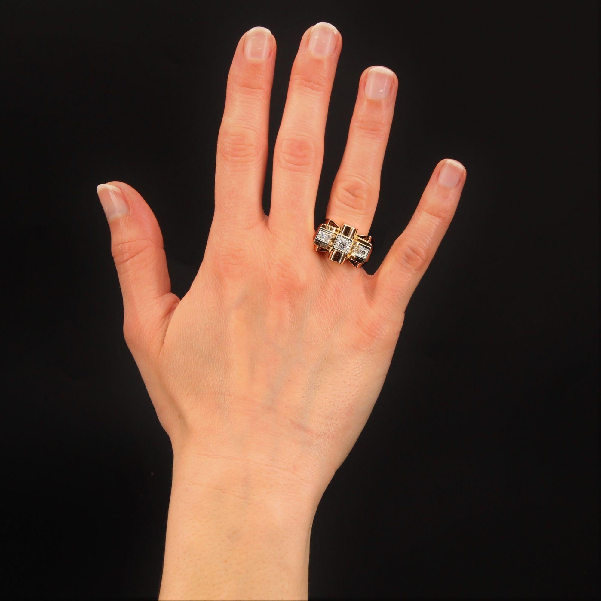 Ring in 18 karat rose gold, eagle head hallmark, and platinum.
Magnificent tank ring, it forms on its top a knot whose center and sides are set with antique brilliant- cut diamonds for the center and 8/8- cut for the sides.
Weight of the central
