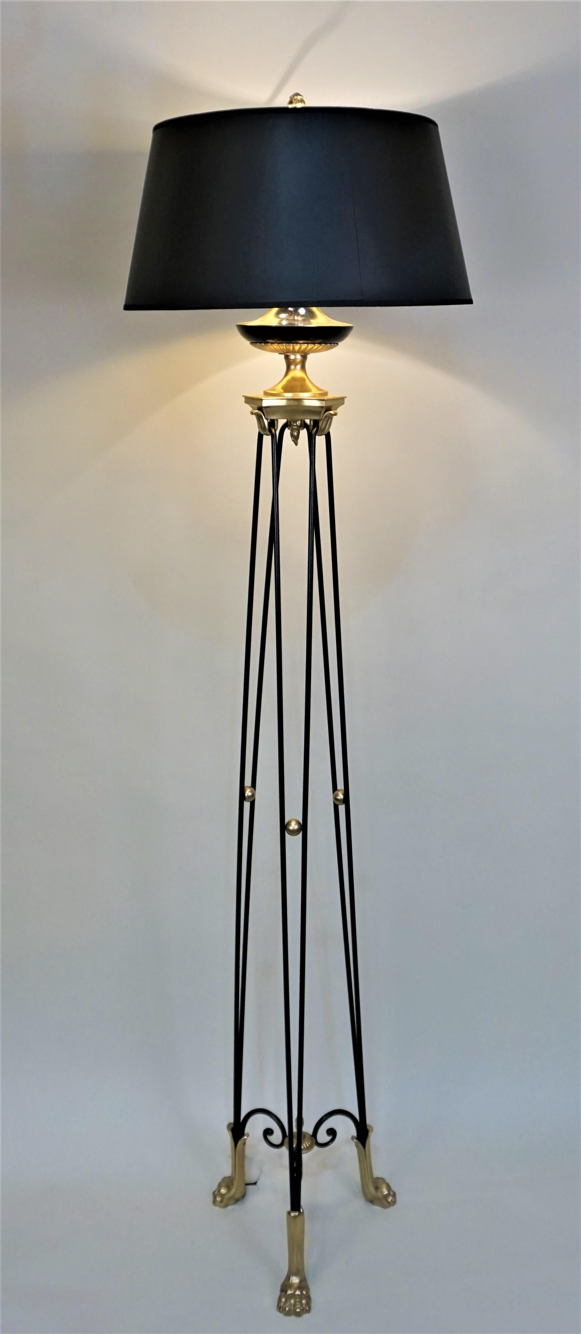 Elegant 1950s Empire style bronze claw foot floor lamp modified with adjustable double socket and fitted with black lampshade.