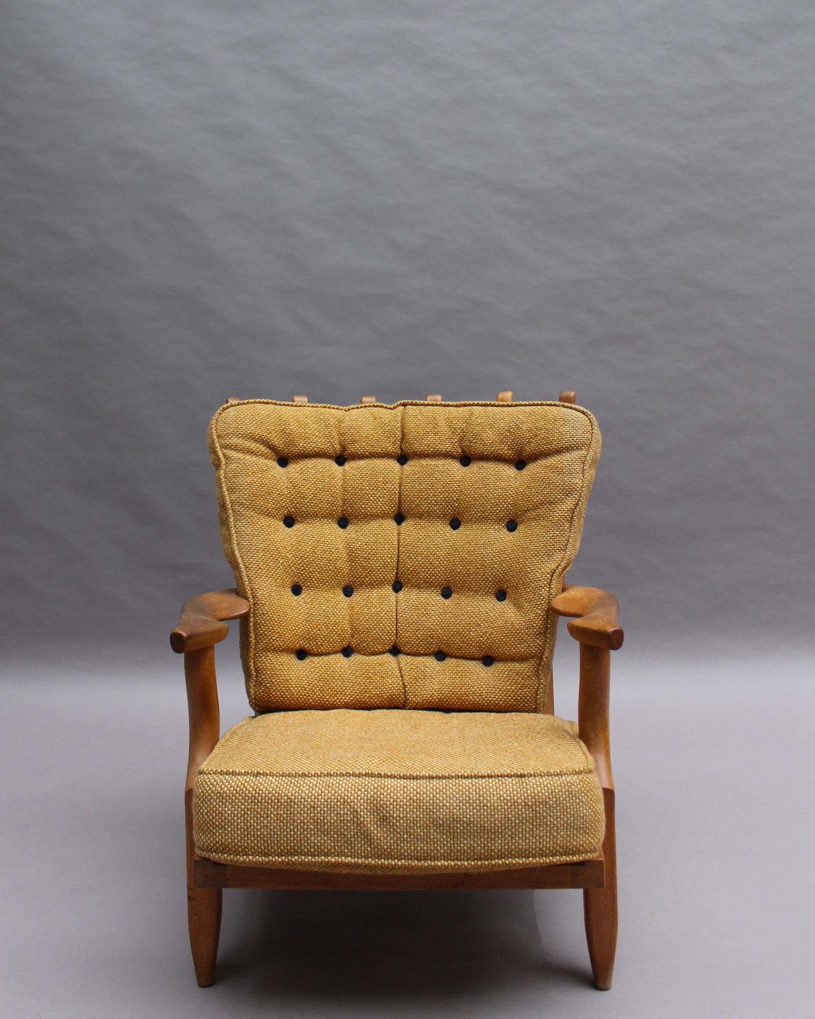 Robert Guillerme & Jacques Chambron - A French midcentury “Grand Repos” armchair in solid oak with its original fabric.