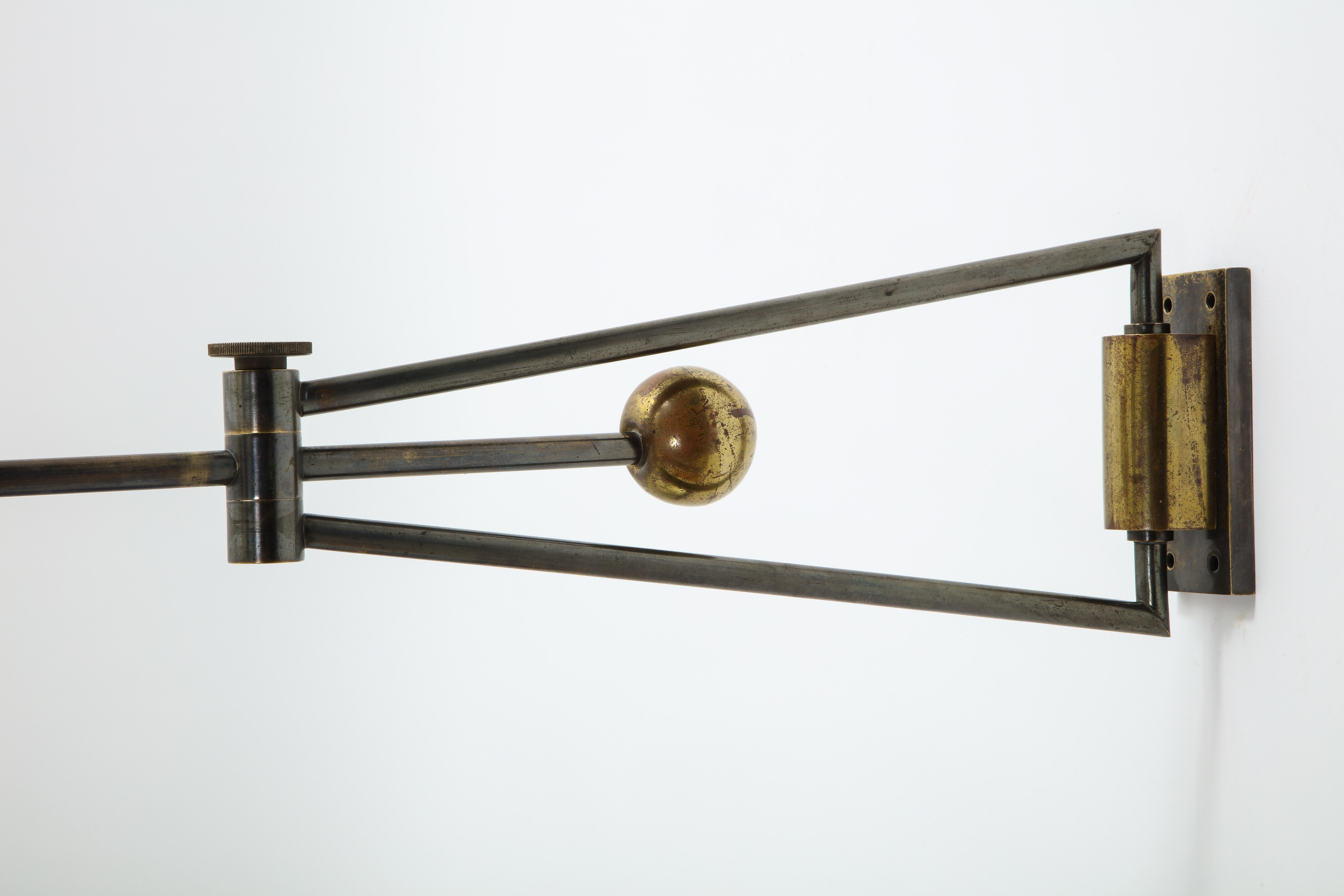 Architectural wall sconce in original gunmetal and brass patinas by Kobis Lorens, adjustable from side to side. 

Shade for pictures purposes, rewiring, and backplates on request. 

Very special patina, modeled with beautiful highs and lows.