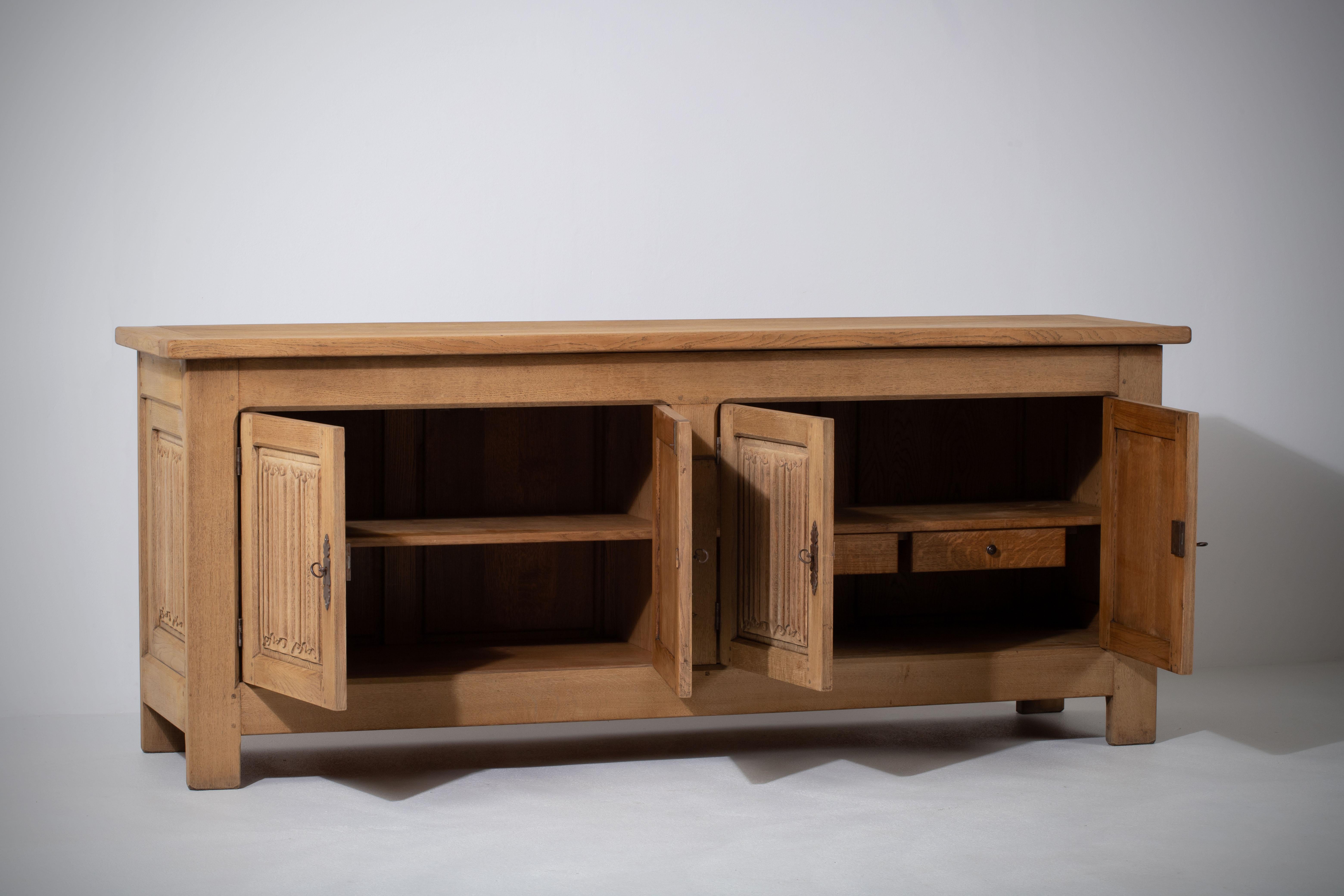 Mid-Century Modern French 1950s Natural Oak Sideboard with Intricate Carved Panels