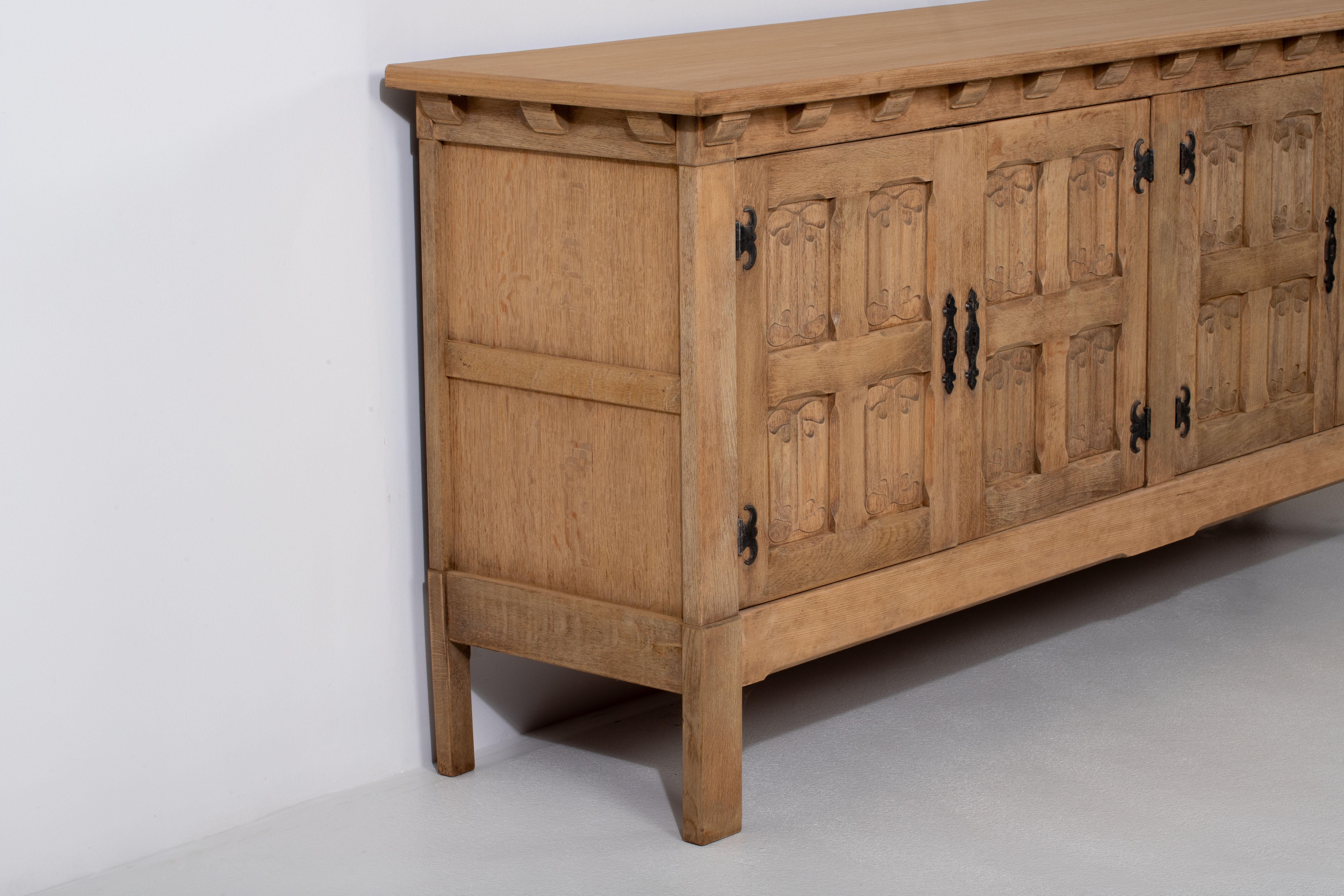 French 1950s Natural Oak Sideboard with Intricate Carved Panels For Sale 1