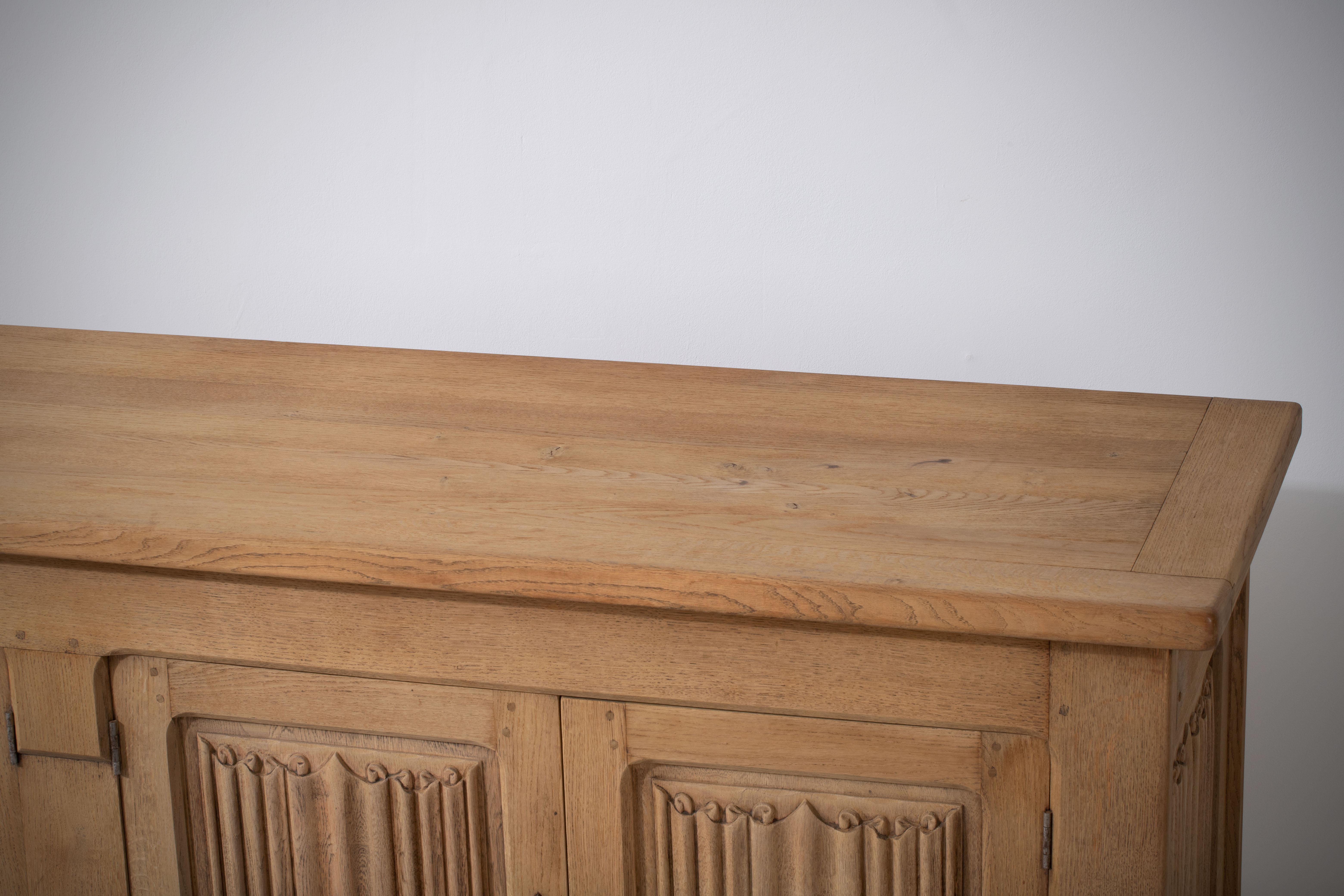 French 1950s Natural Oak Sideboard with Intricate Carved Panels 3