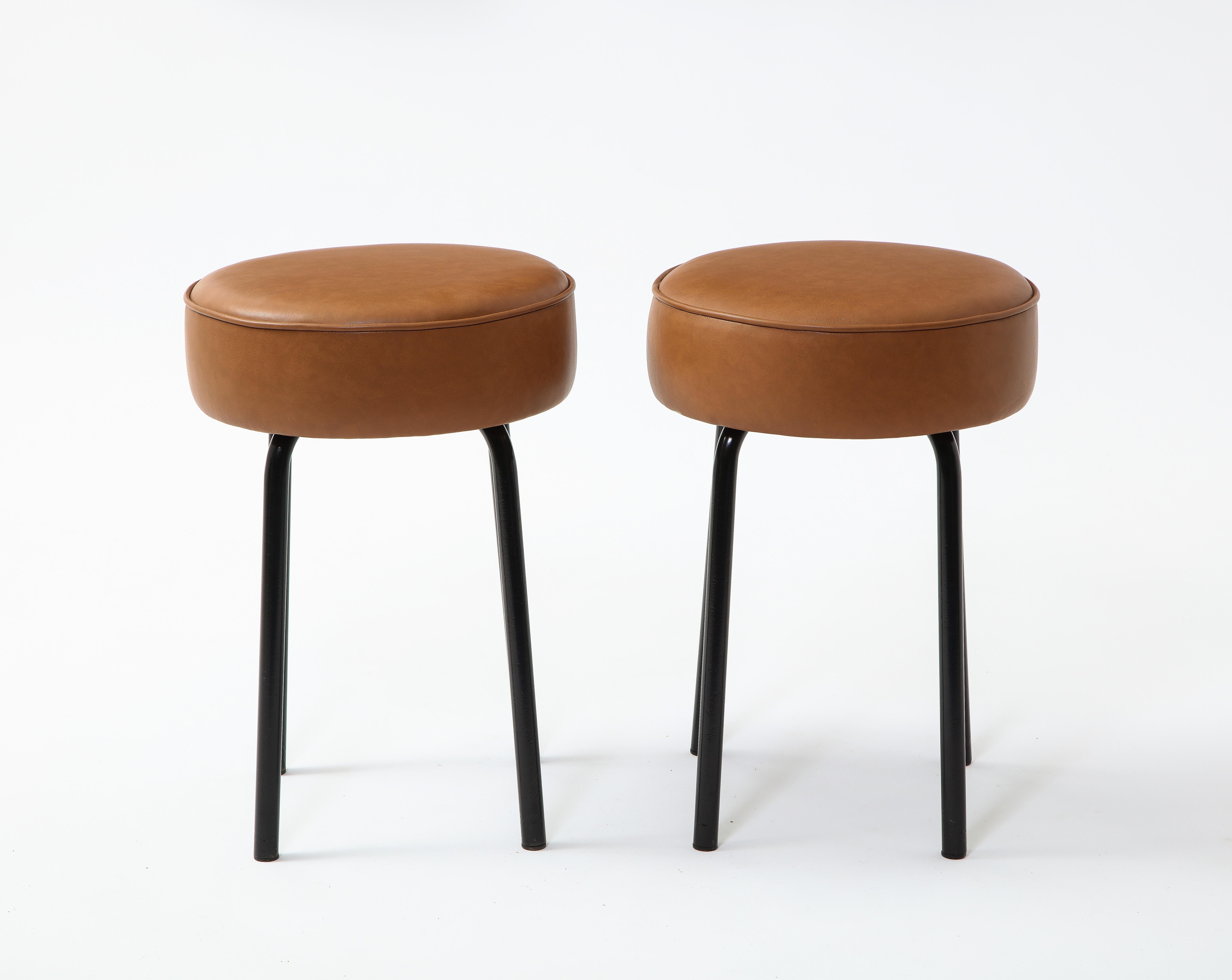 Black enameled base and new leather upholstery on these stools reminiscent of the work of Prouve. Clean industrial lines. 

We are happy to recover these upon request, at additional cost.
