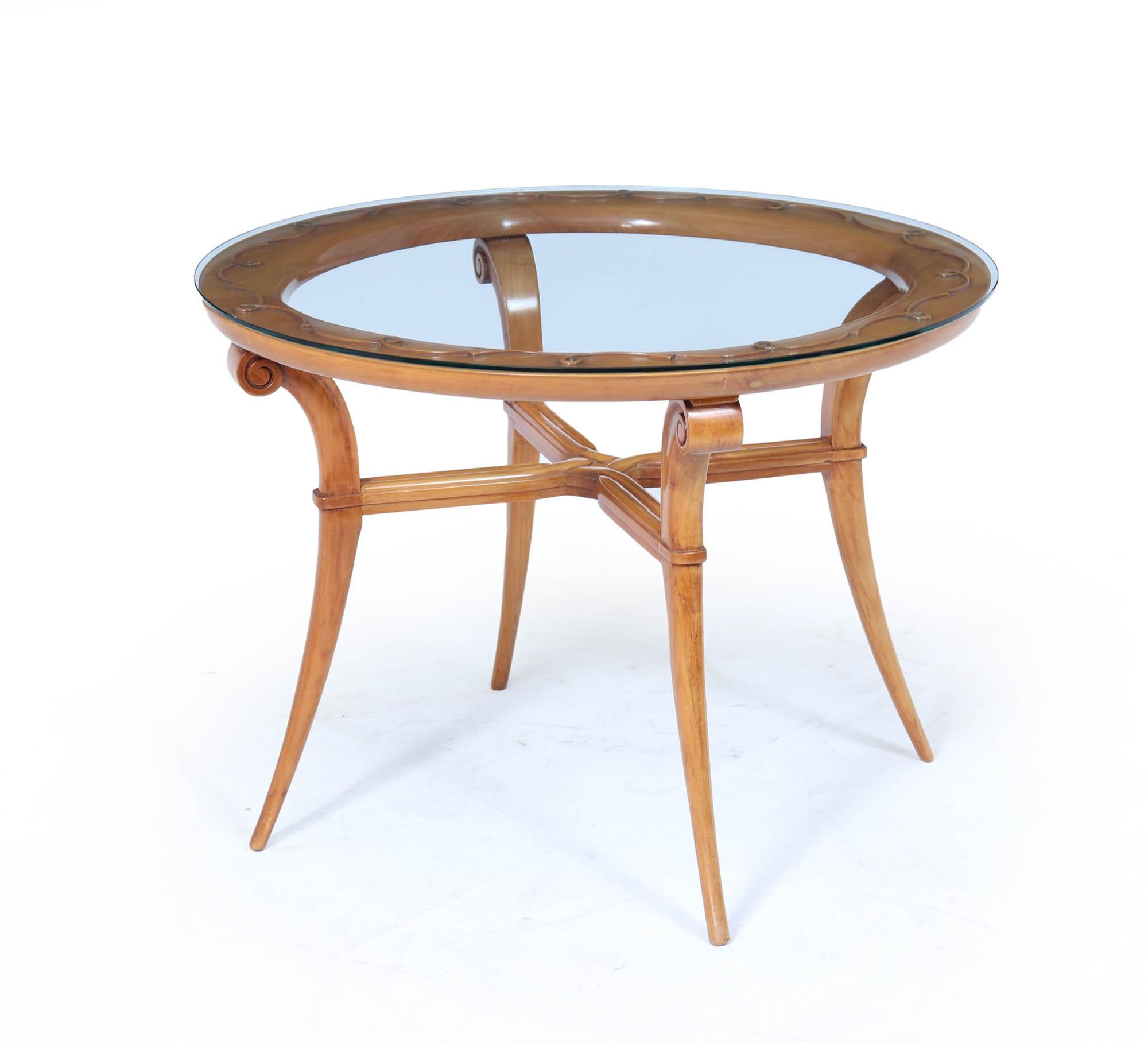 French 1950s coffee Table 
A beautifully sculptural and elegant centre or occasional table, French, circa 1950s, in the manner of René Prou. The lightly curved legs and scroll-knee detailing give it a strong architectural presence, while the thick