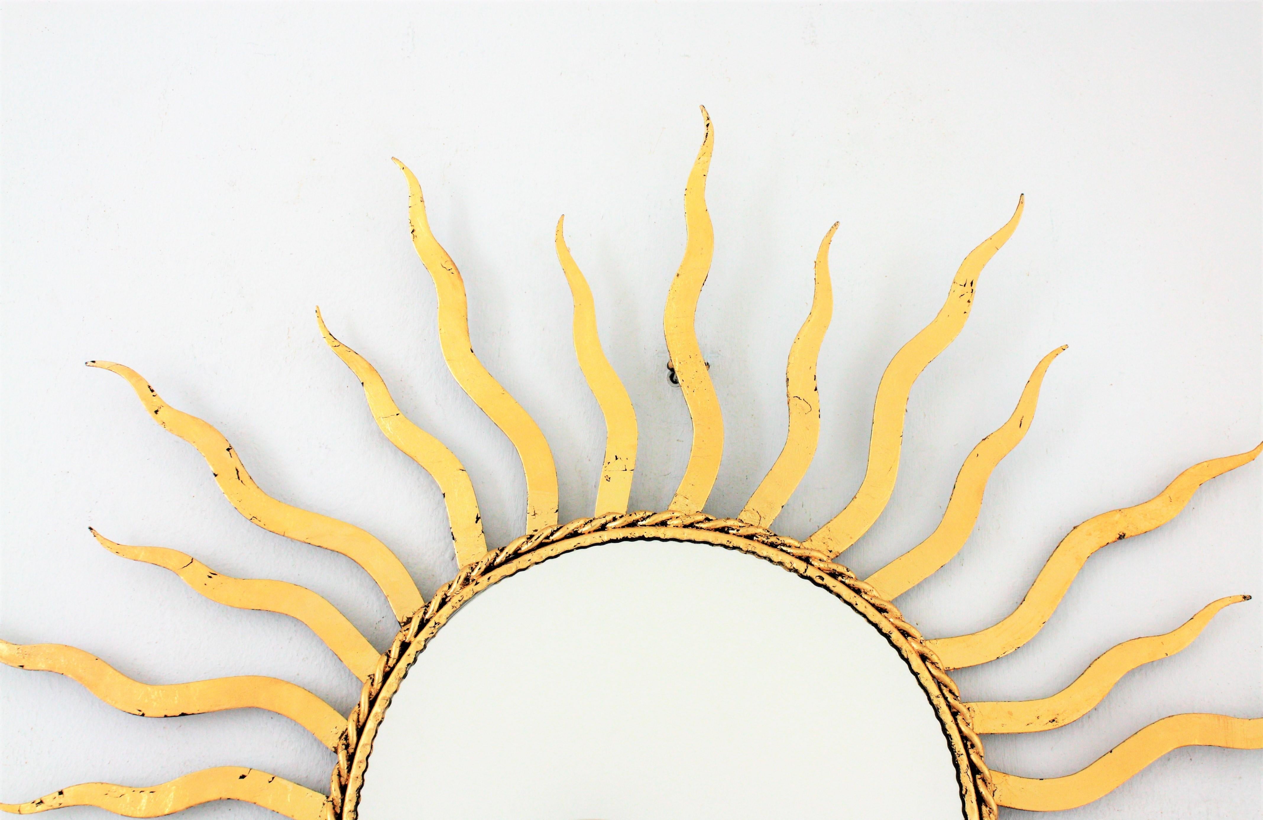 French 1950s Wrought Gilt Iron Sunburst Mirror in the Style of Gilbert Poillerat 4