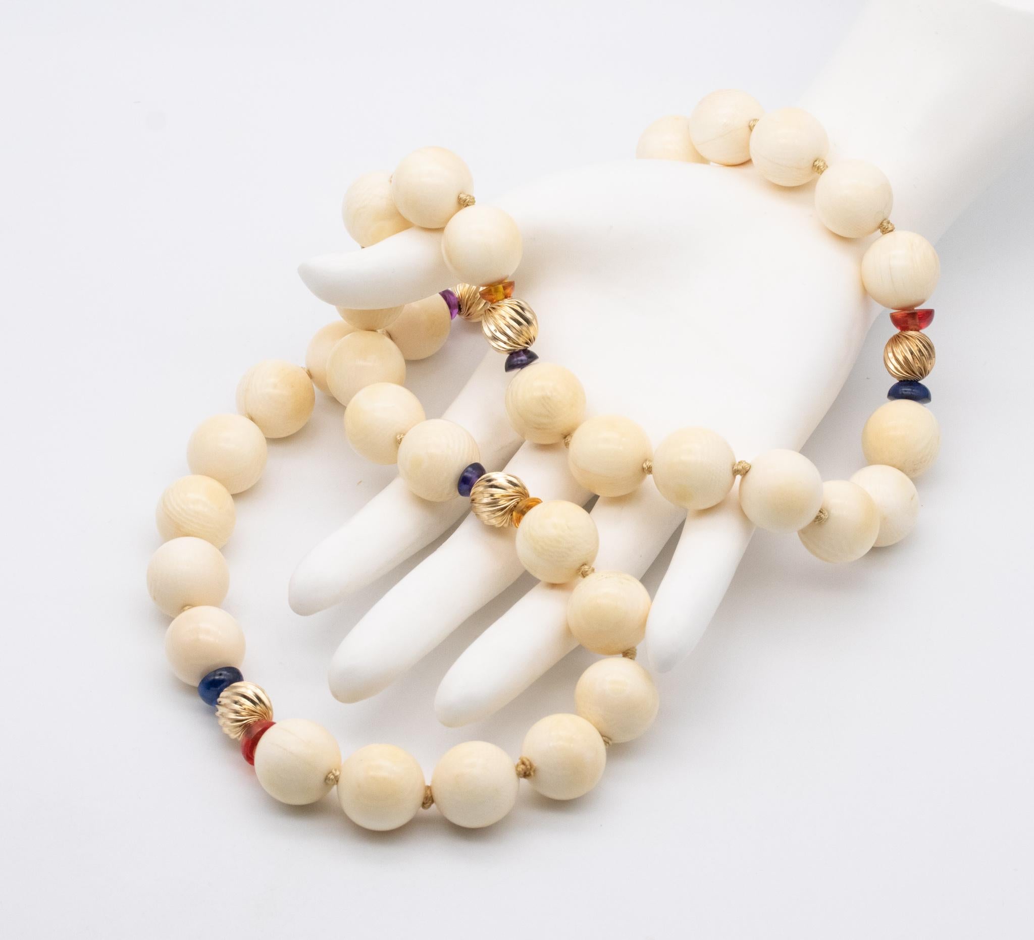 Elegant French Necklace with carved Gemstones

A vintage mid-century piece made in france, back in the 1960's. It is composed by 5 fluted spacers, crafted in 18 karats yellow gold, 10 half spheres carved from natural tourmaline of different colors