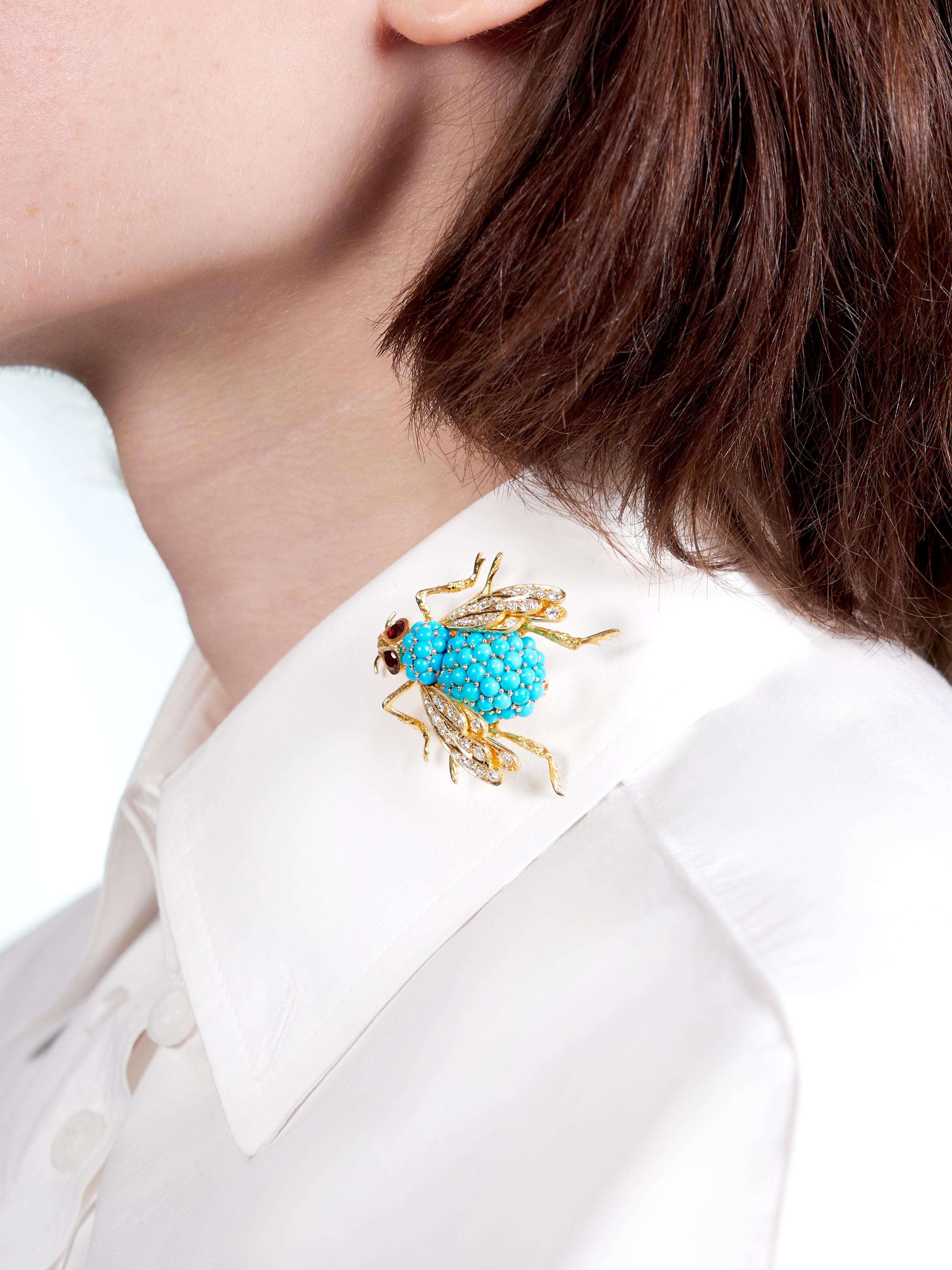 Designed as a stylized bee with pave turquoise cabochon body
Opaque robin's egg blue and ranging from 2.5 to 3.5 mm in size
Featuring round brilliant cut diamonds bead set on wings
Weighing approximately 1.30 carats total - G/H color with VS2