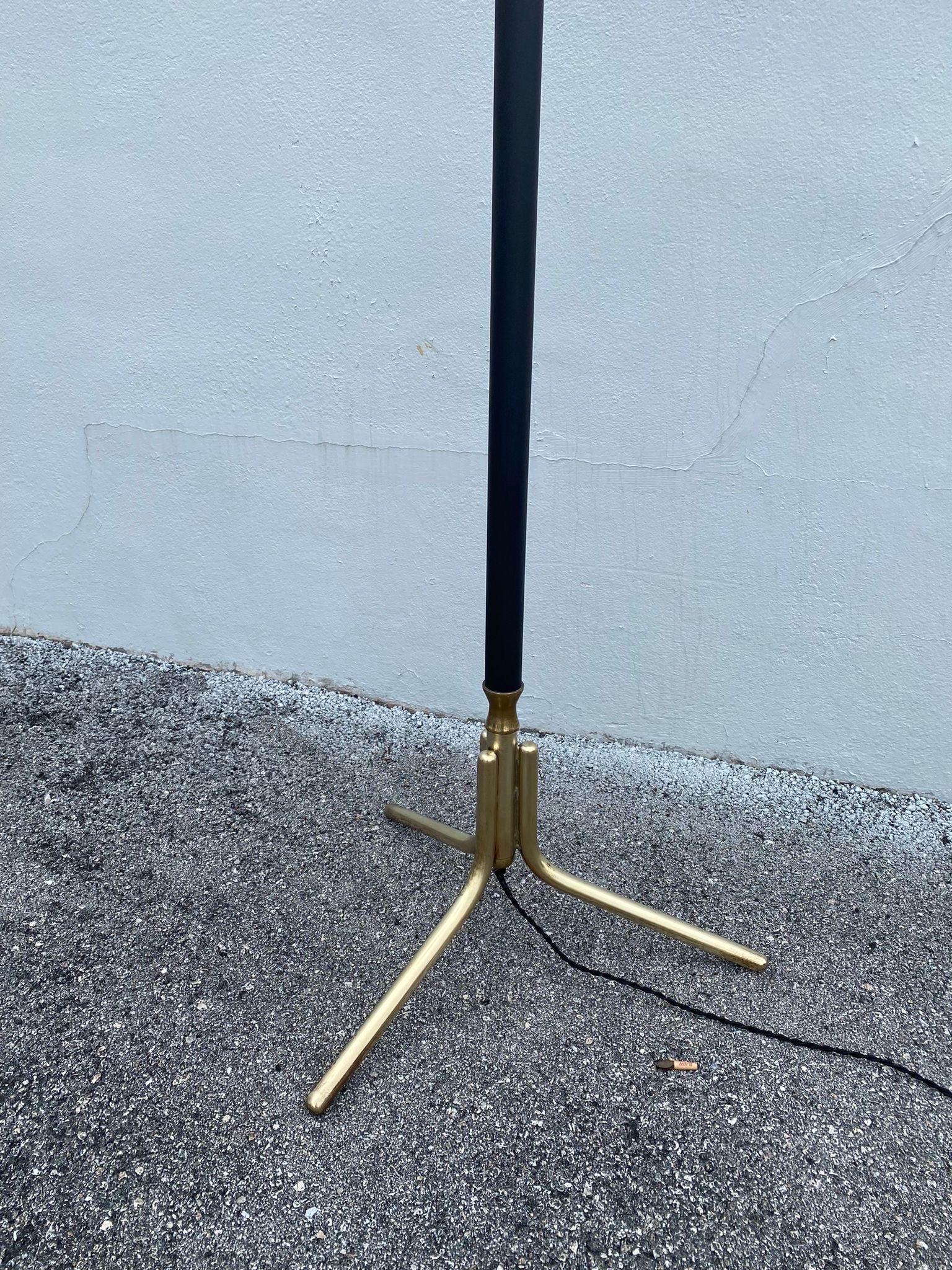 This stunning 6-light floor lamp in brass and black metal with newly restored custom shades in conical design.  Beautiful vintage piece in clean vintage condition and newly rewired.  Original shades have been recovered in off-white parchment paper. 