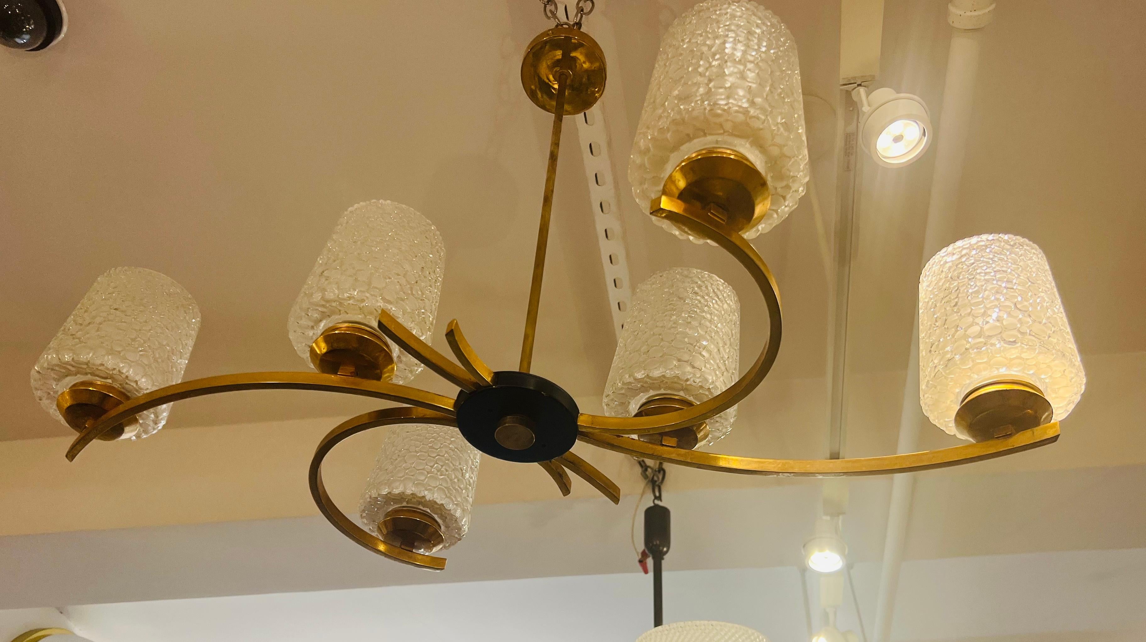 A wonderful 1960s french chandelier with a six golden brass socket body with hand blown lightly frosted glass bubble shades. Newly rewired. Made by the French lighting company, Arlus.