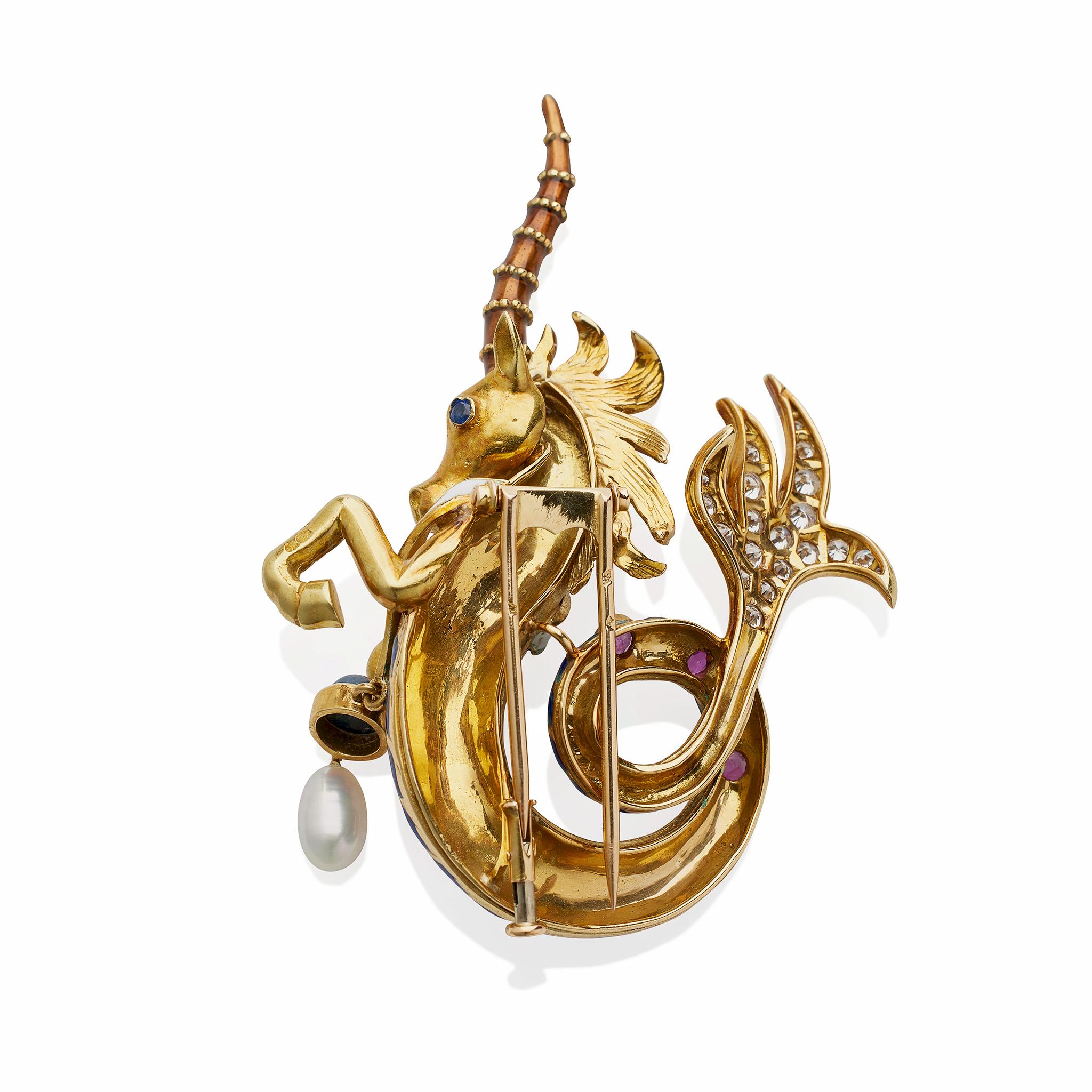 Made by Jean Thierry Bondt, Paris, a creator of jewelry for Van Cleef & Arpels, Lacloche, Cartier, and Mauboussin, among others, this 18K gold and enamel unicorn clip brooch is set with diamonds and colored stones. The highly three dimensional sea