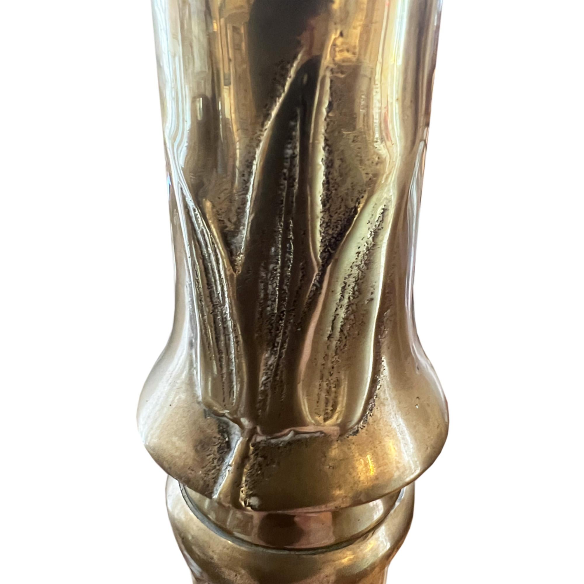 This is a great brass midcentury floor lamp -  which detailed faux bamboo decoration which extends down to the base.

Made in France it is elegant, as well as being solid and sturdy. 

We've had it rewired by our electrician for the UK with twisted