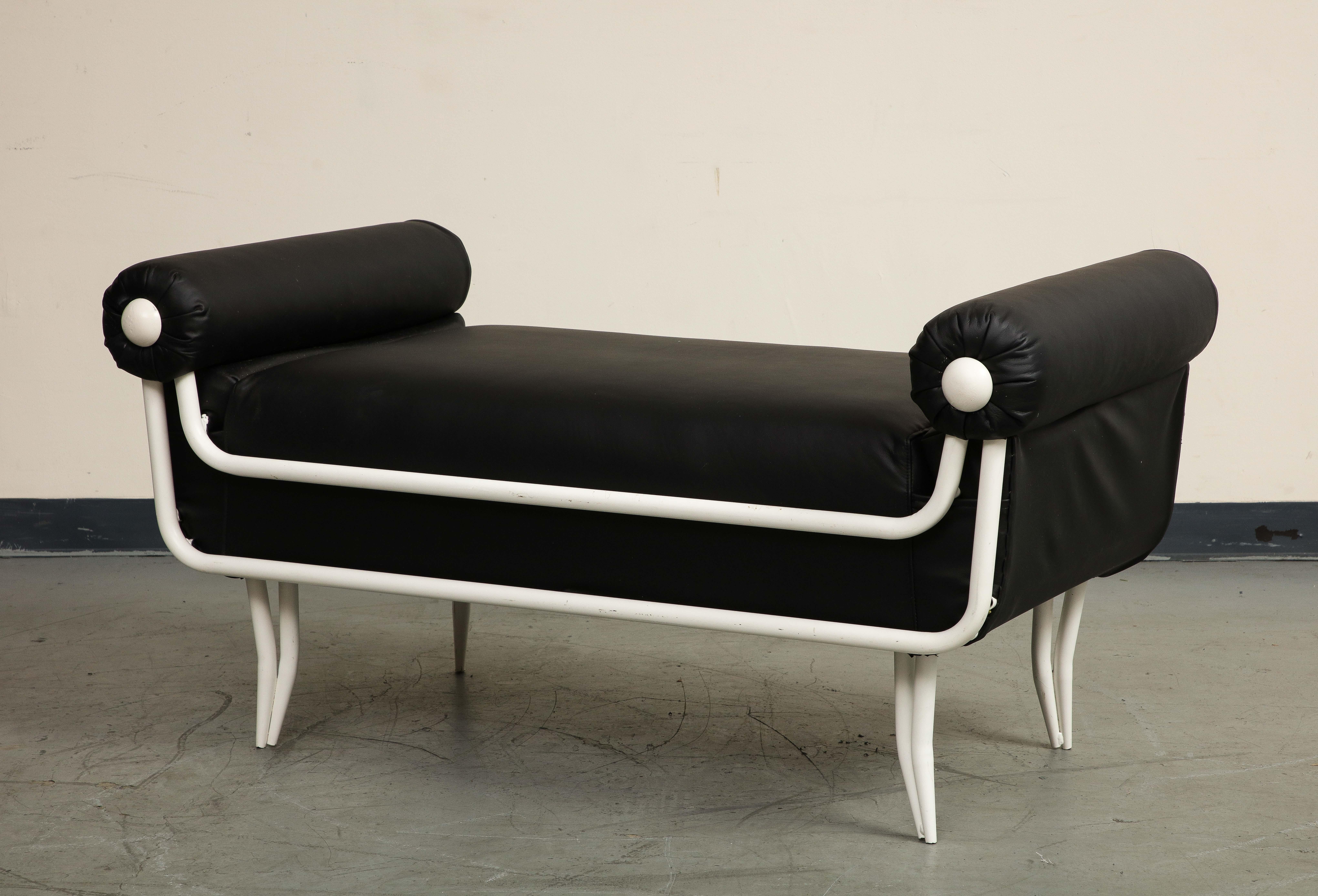 French 1960s white painted iron and black leather daybed or bench, newly upholstered in 2022 and not used since. The rolled bolster style arms are fully covered in black leather and feature white buttons on the front for contrast. In the style of