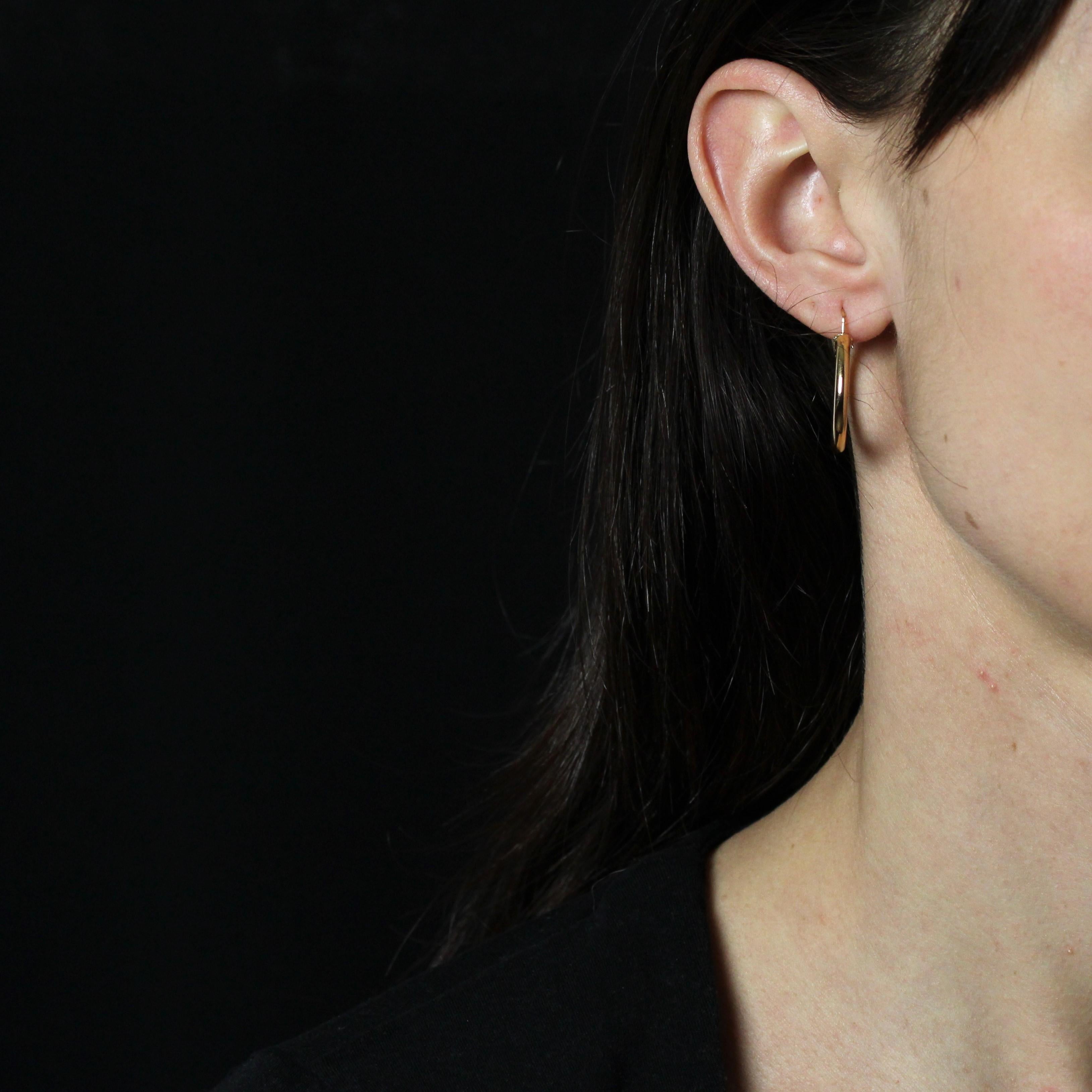 For pierced ears.
Earrings in 18k rose gold, eagle head hallmark
Called Hoop earrings, each is formed by a gold hoop open at the top and features a clasp that can be threaded through the front or back. Each rose gold earring has a gold twist
