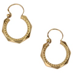 French 1960s Vintage 18 Karat Yellow Gold Faceted Chiseled Hoop Earrings