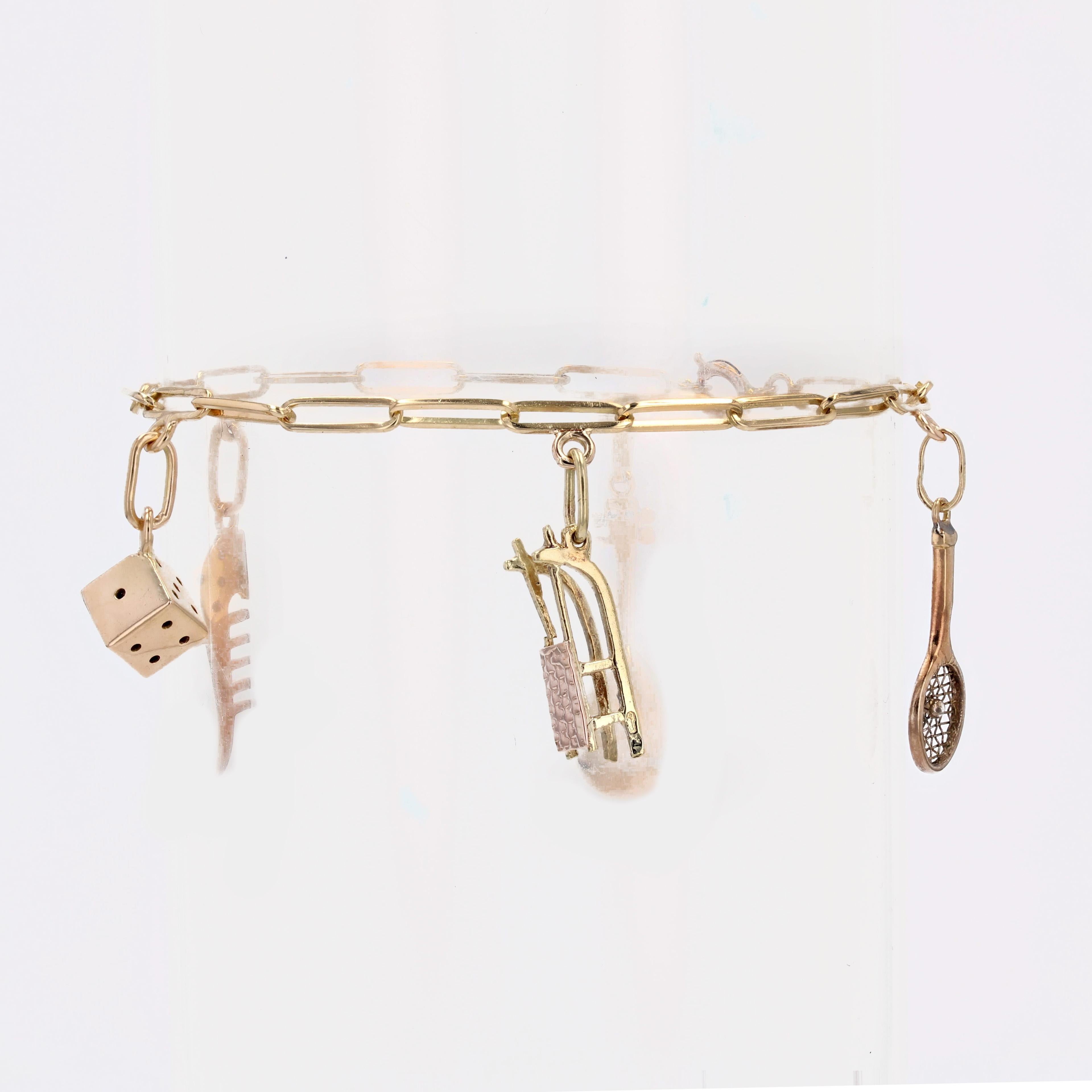 French 1960s Retro Charms 18 karat Yellow Gold Figaro Mesh Bracelet For Sale 1
