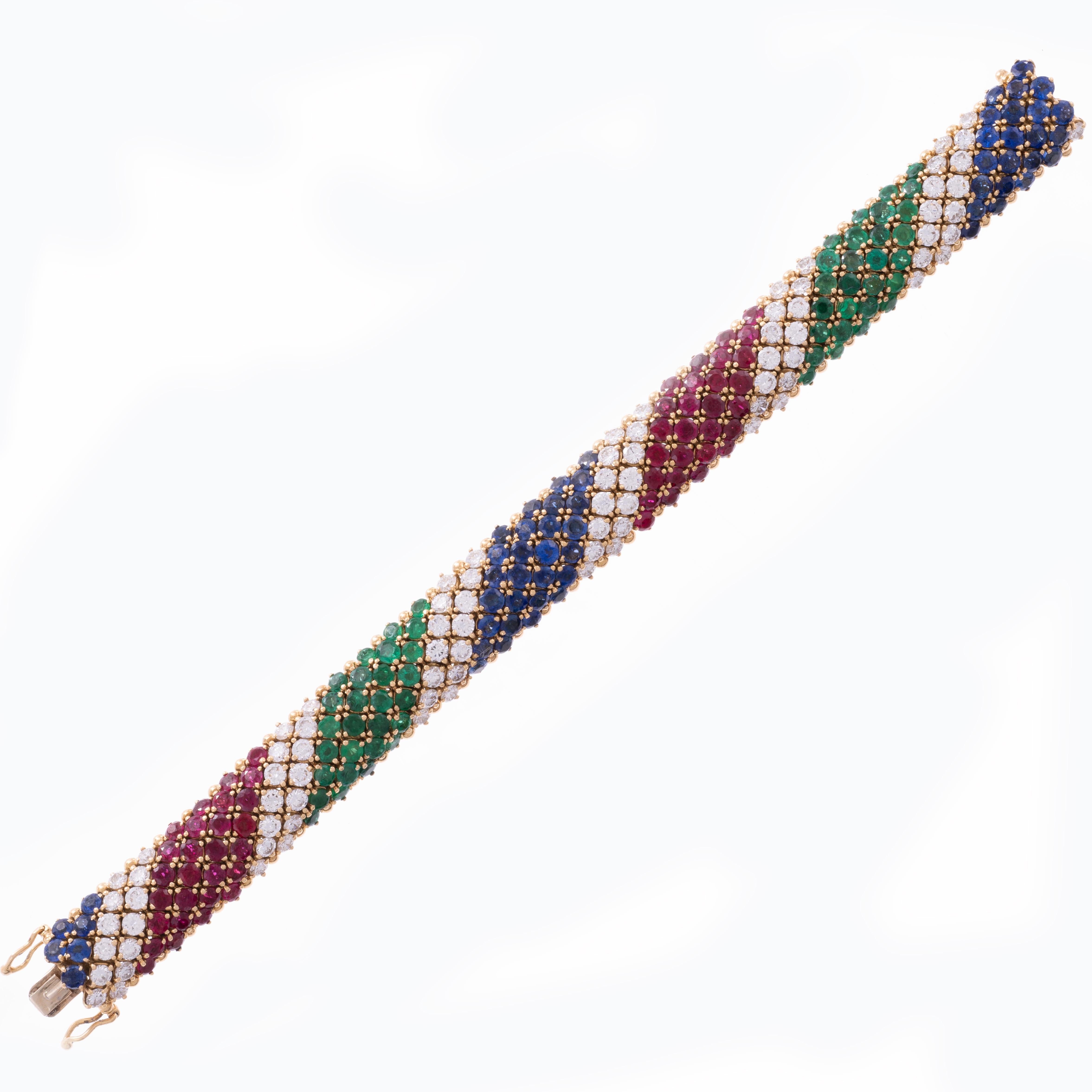 French Gemstone “Barber Pole” Bracelet - Exquisitely appointed with royal blue sapphires (11.20 carats), rich red rubies (8.50 carats), intense green emeralds (6.16 carats) and brilliant white diamonds (8.40 carats), this striking bracelet marries