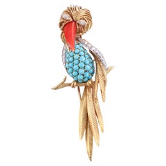 Broche oiseau toucan française des années 1960 en or, turquoise, corail et diamant 