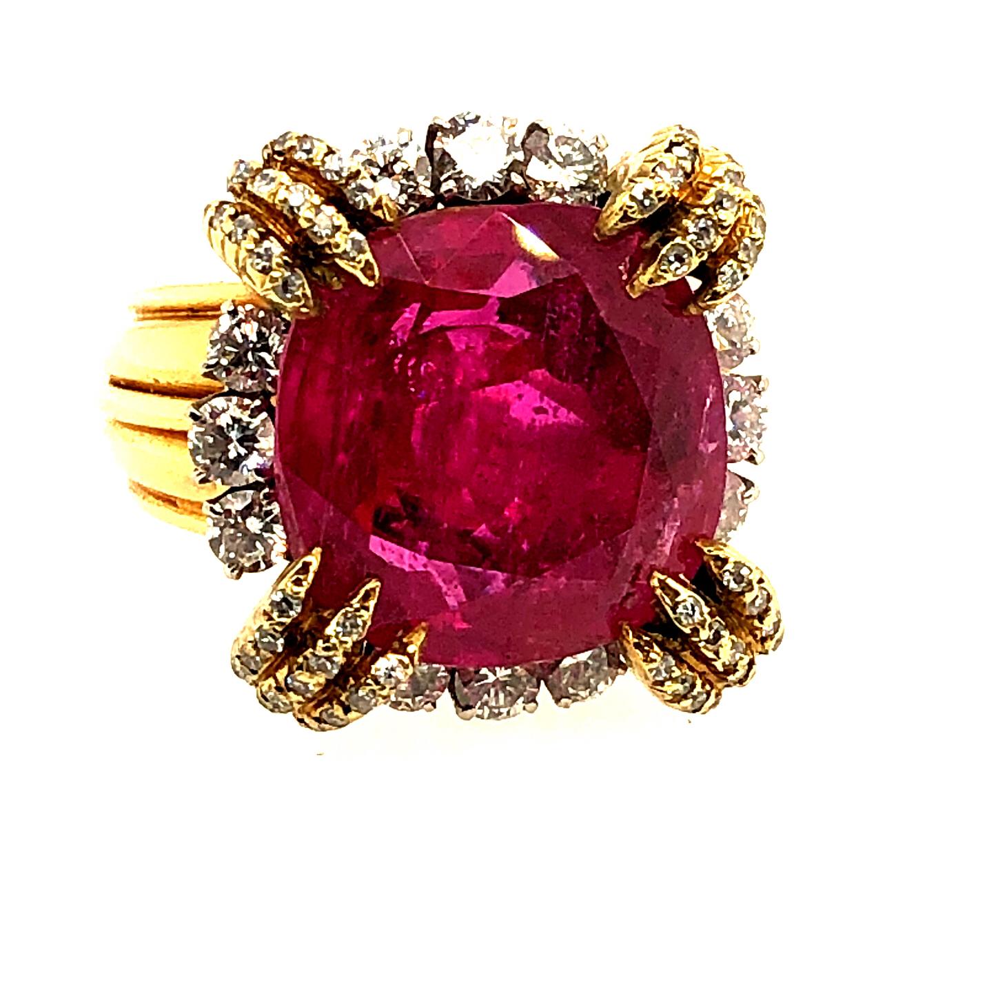 Offered here is a rare find, a certified No Heat Burma Ruby ( estimated at over 13 carat ) set in a unique yellow gold and platinum ring. The ring is stamped on the outside of the shank with a French hallmark, 750  (  eagle, dog ) and makers mark.