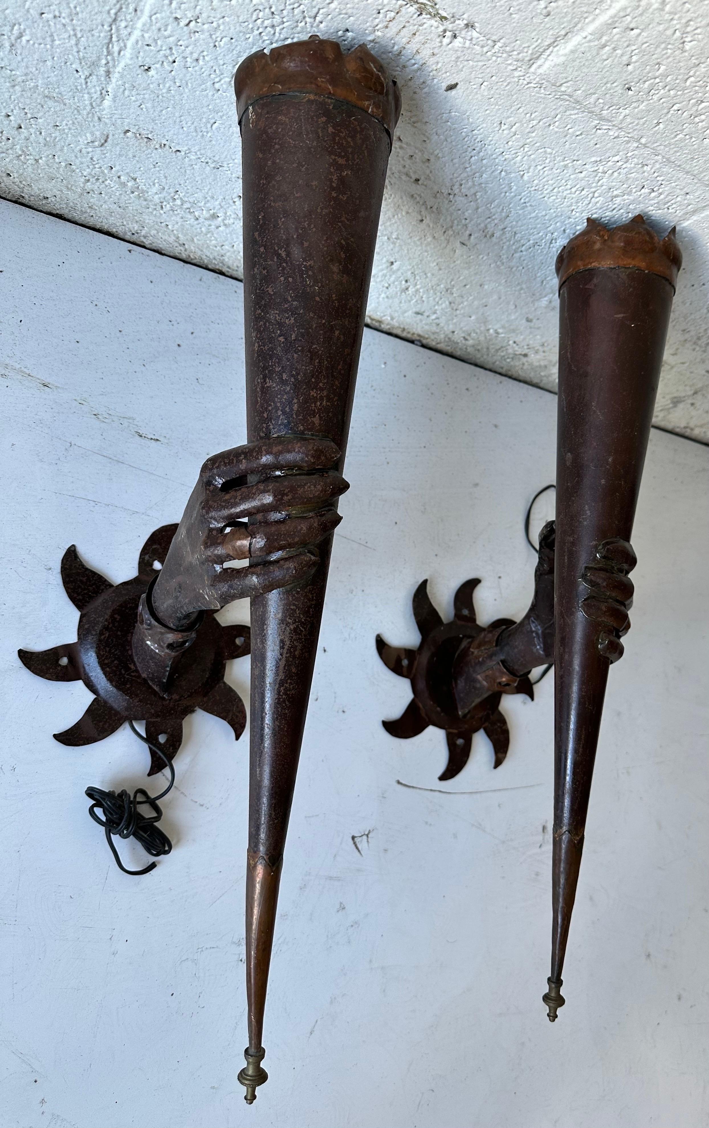 French 1960’s  Wrought Iron Torchieres
Backplates are 8 inches diameter.