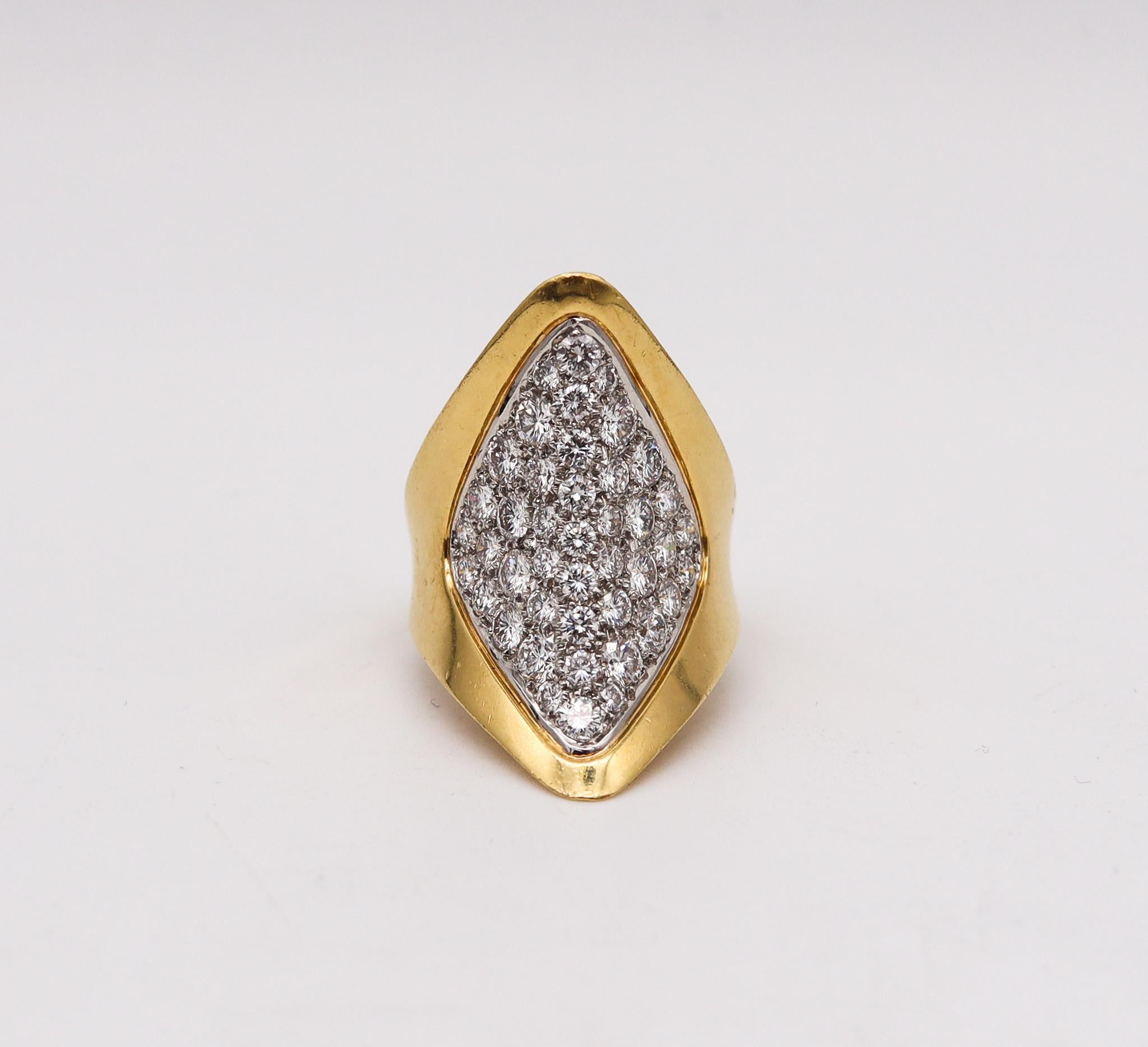 French cocktail ring with diamonds

Gorgeous aerodynamic ring, created in Paris France during the modernism period, back in the 1970's. This cocktail ring, has been crafted with architectural patterns in two parts. One made up in solid yellow gold