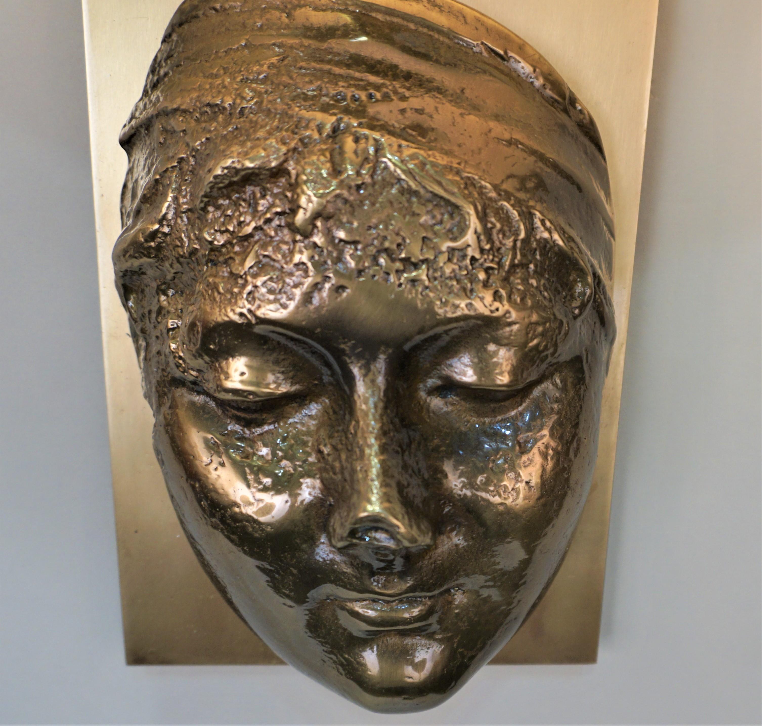 Classics design sculpture of bronze face wall sconces with special silk hardback lampshade.